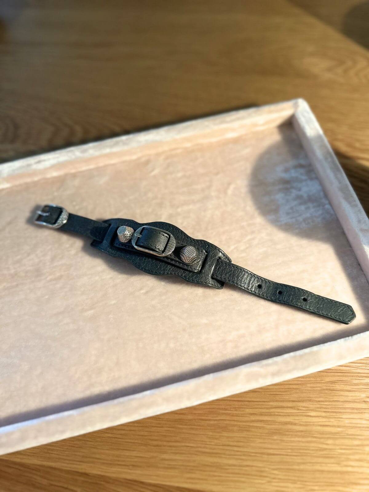 Balenciaga leather bracelet on pink display