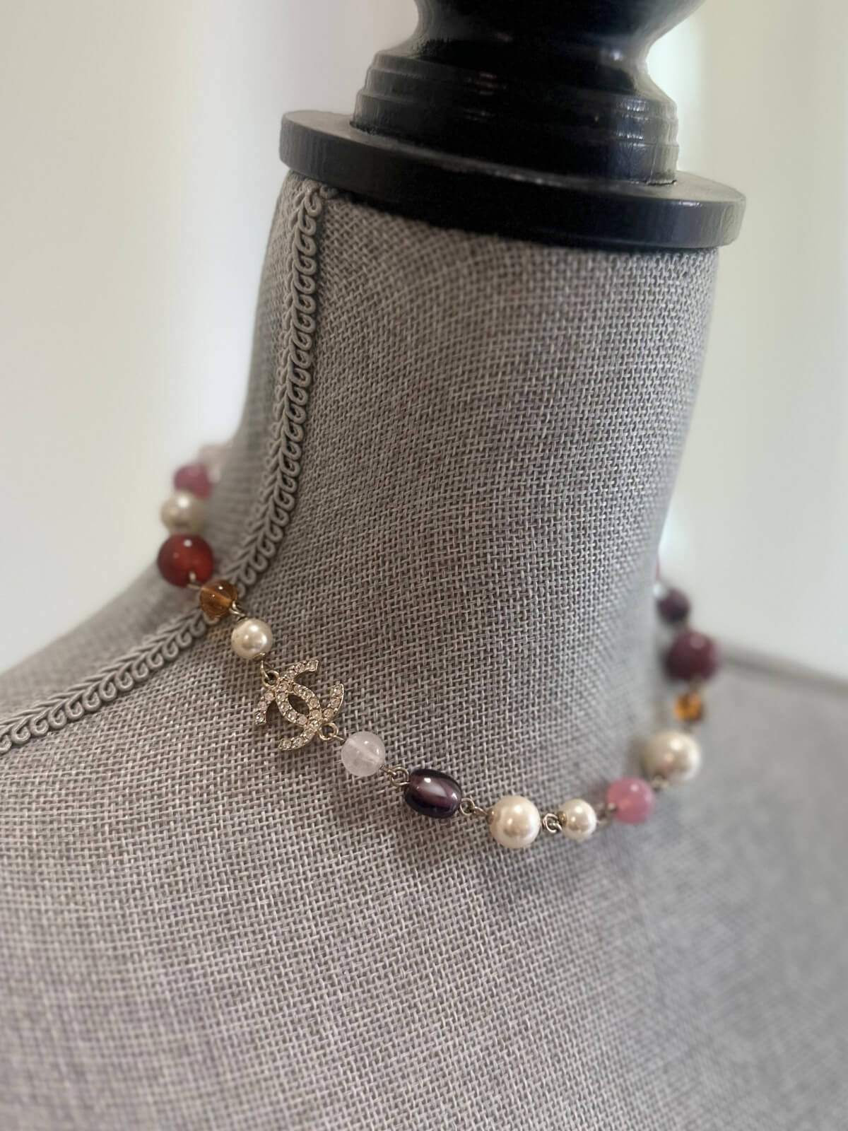 Louise Row featuring Chanel beaded necklace on grey mannequin