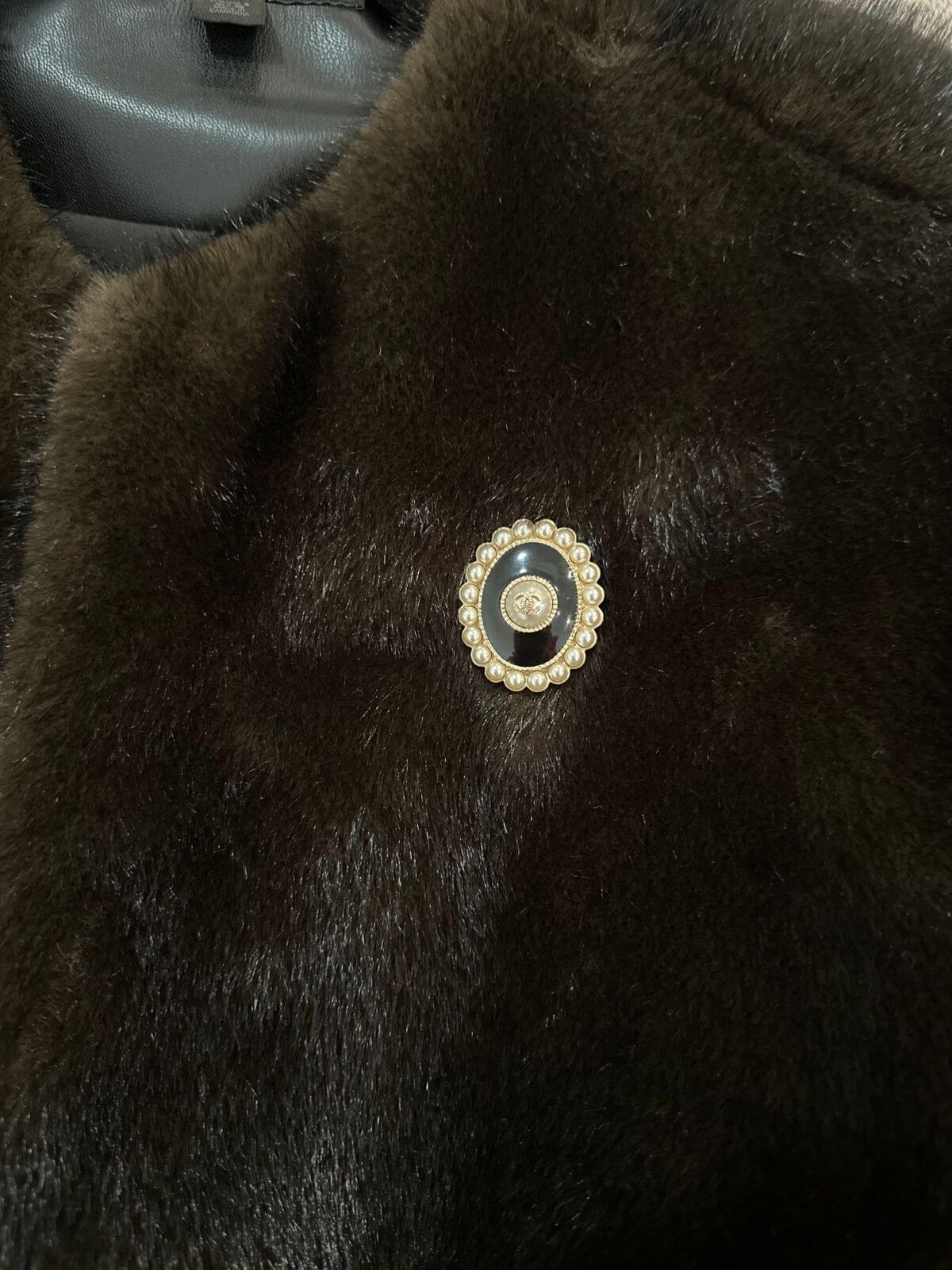 Chanel Oval brooch on brown fur