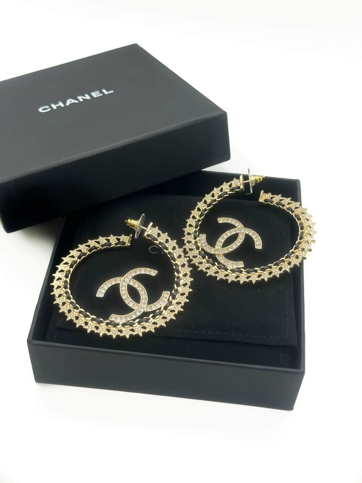 Chanel star hoop earring in black box