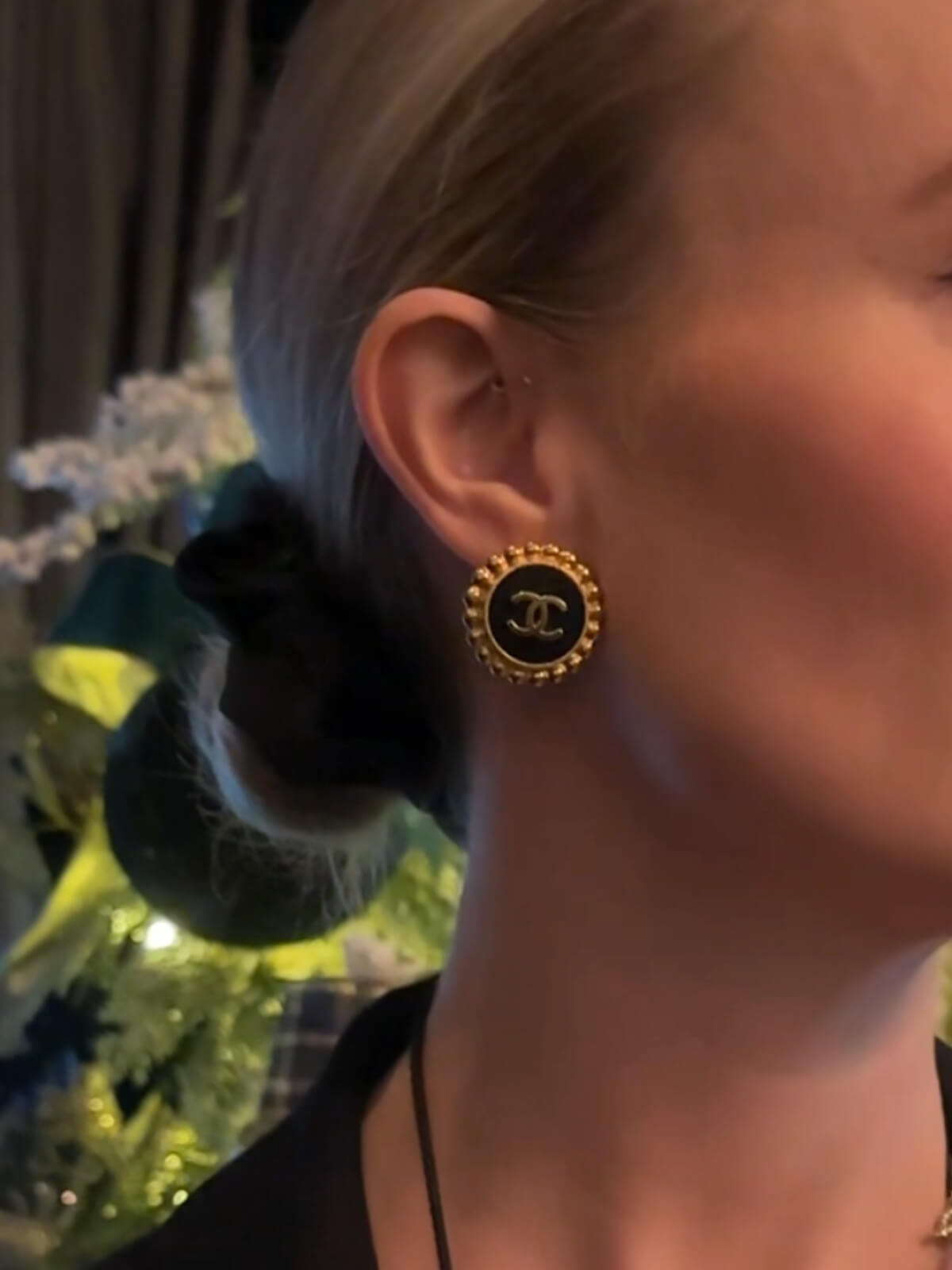 Louise Row featuring Model in Chanel black and gold clip on earrings.