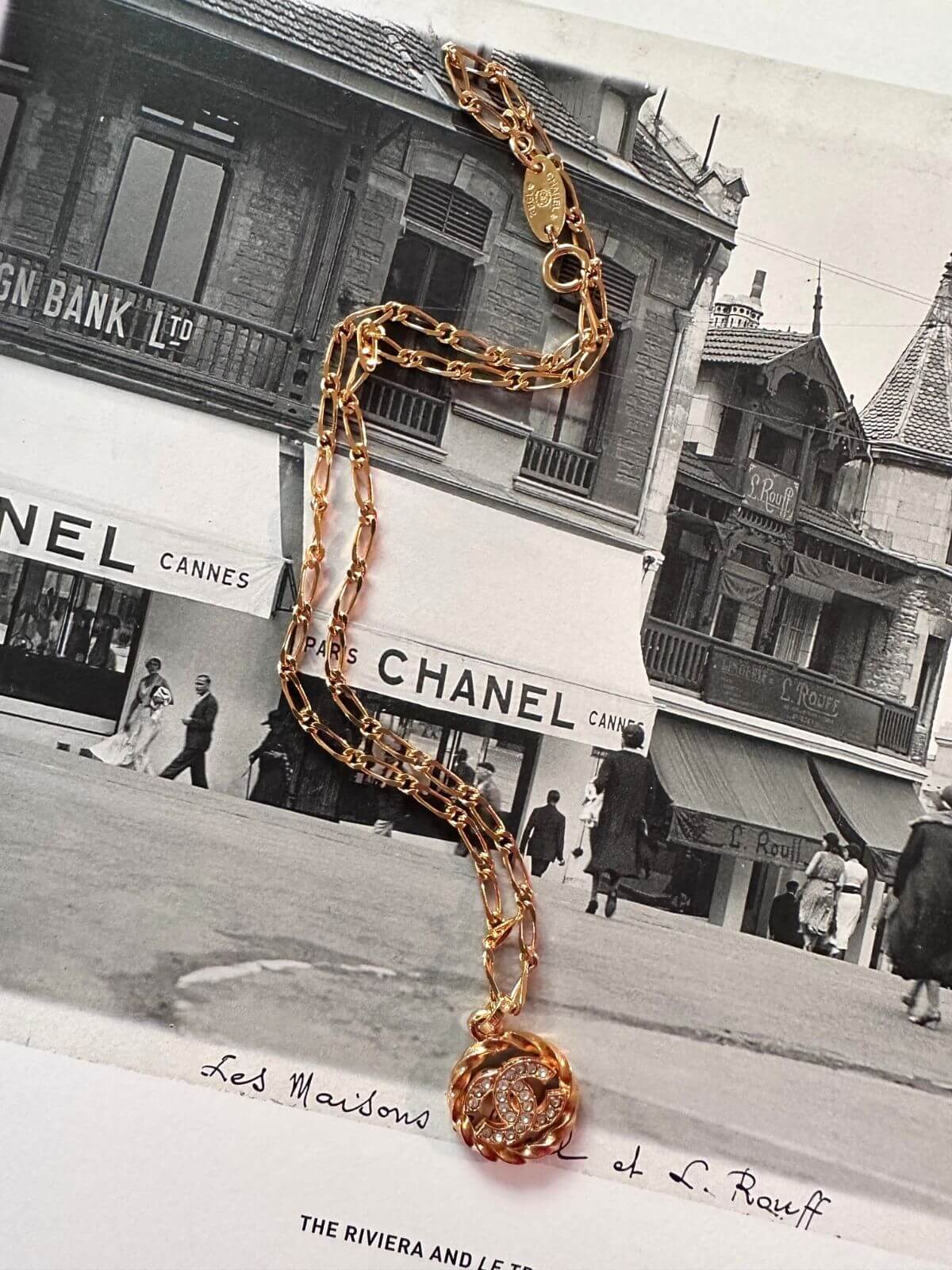 Chanel necklace on magazine.