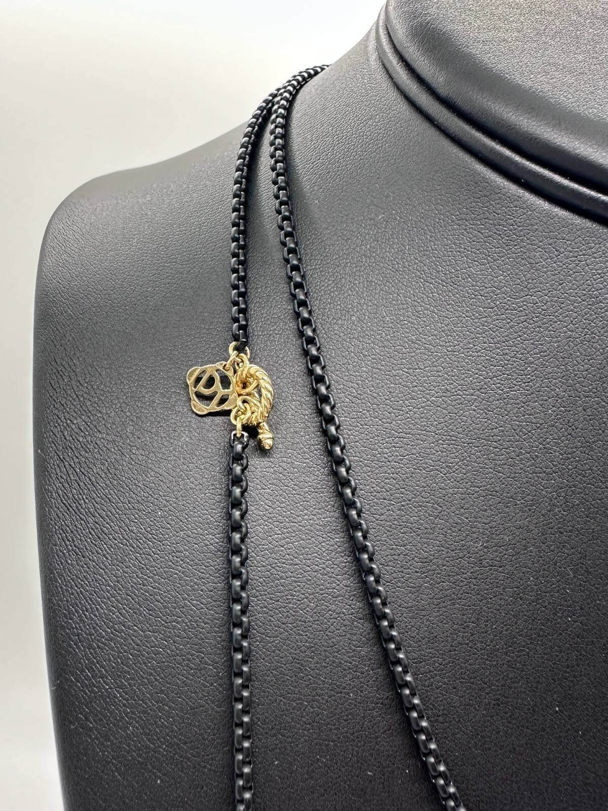 Detail of David Yurman Black chain necklace on a black mannequin bust with a white background