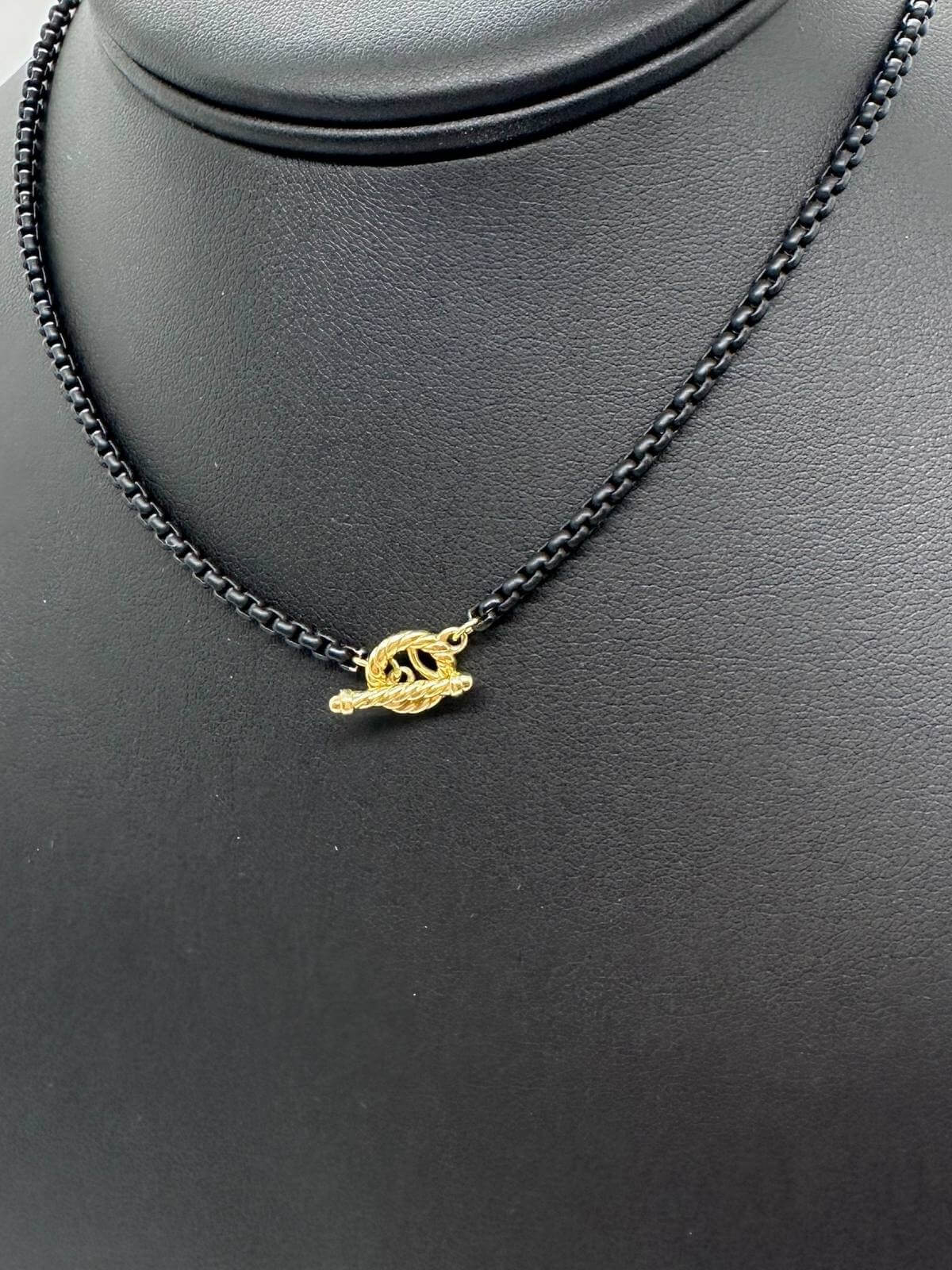 Detail of David Yurman Black chain necklace on a black mannequin bust with a white background