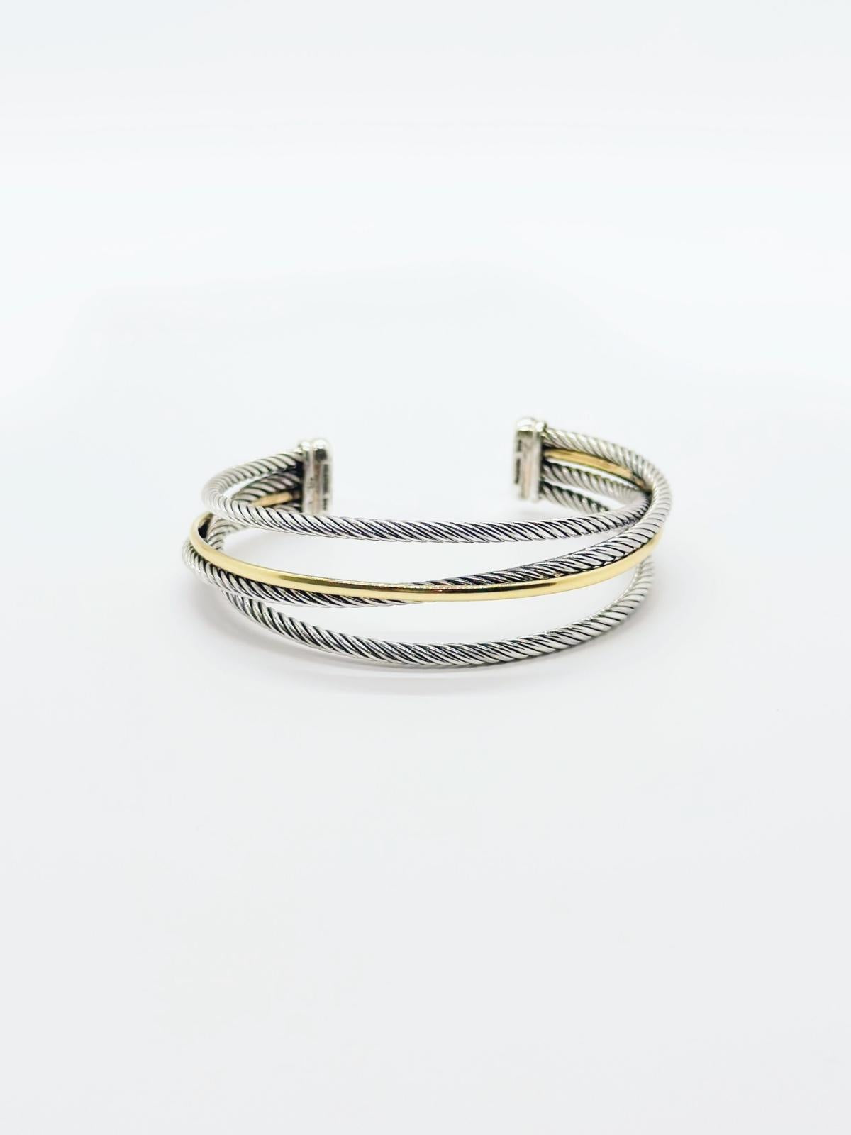 David Yurman Crossover cuff in gold and silver on white background