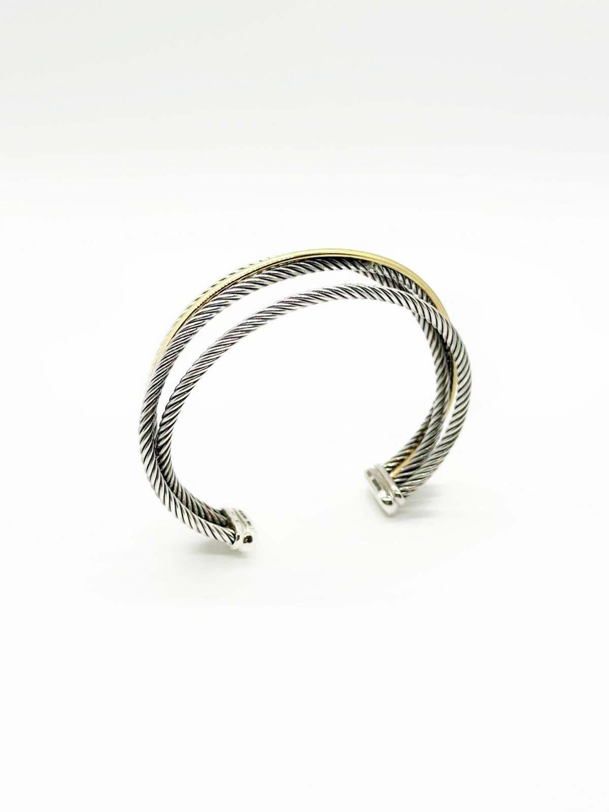 David Yurman Crossover cuff in gold and silver on white background