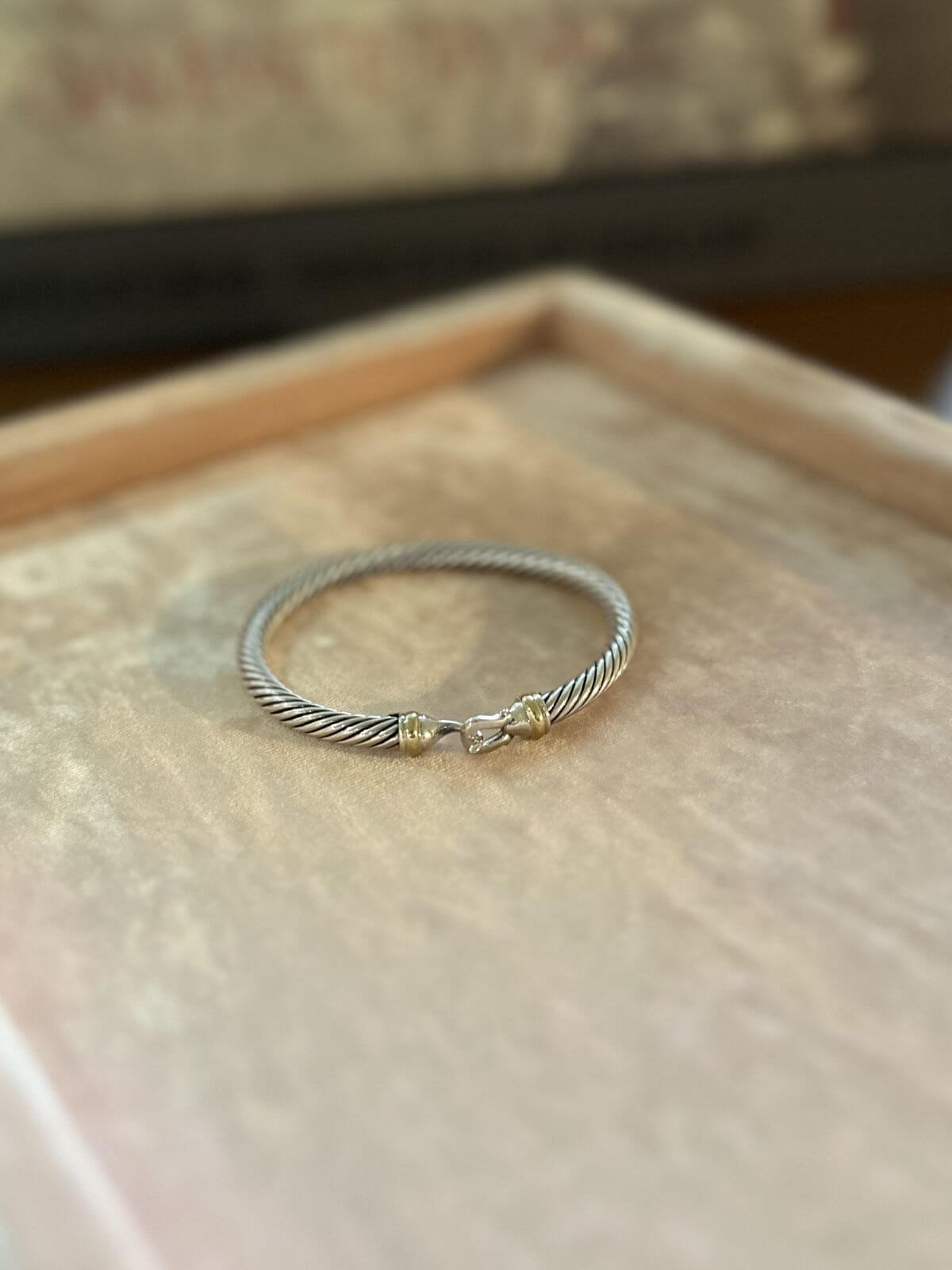 David Yurman buckle bracelet on pink display