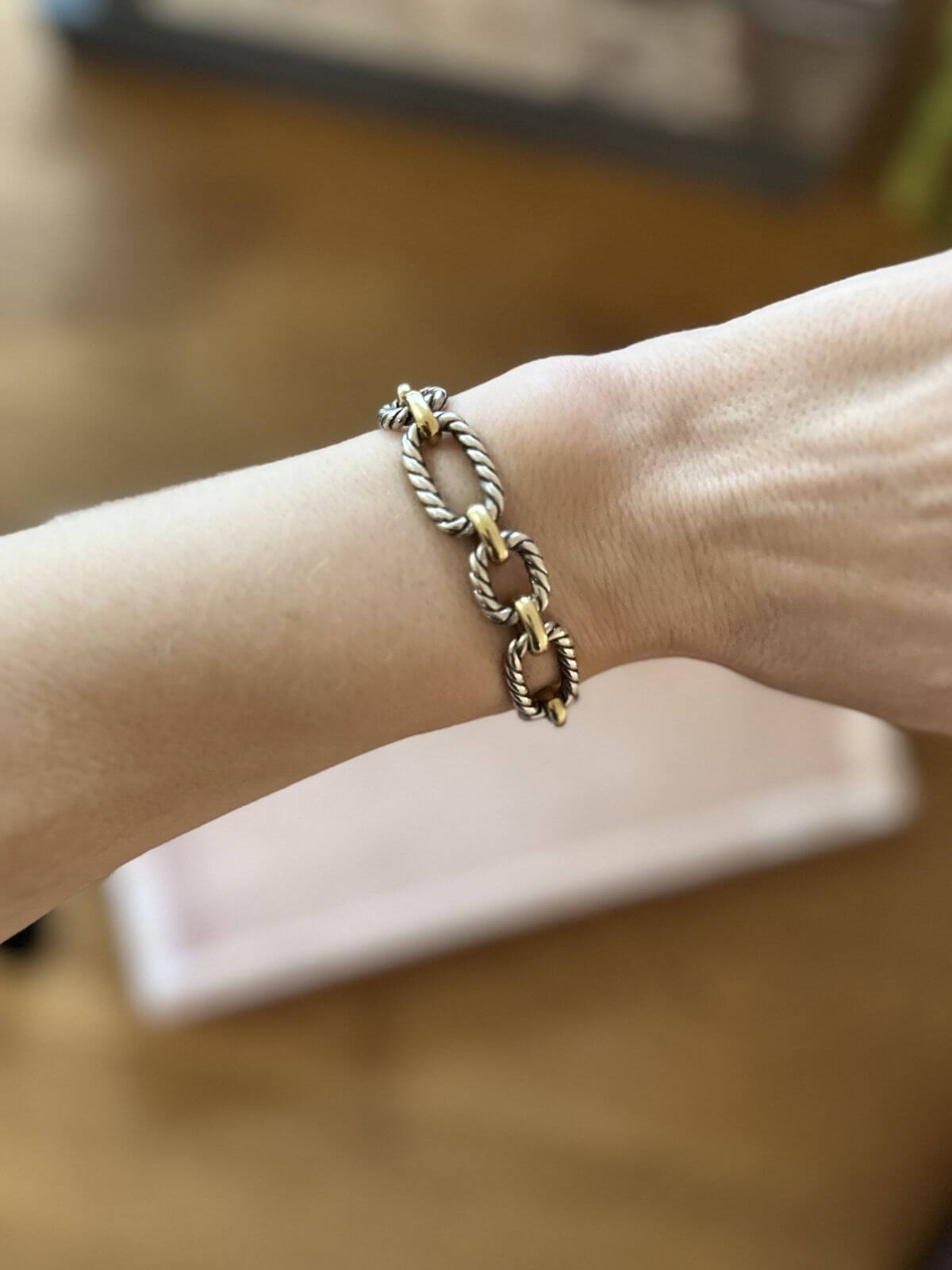 David Yurman gold and silver toggle bracelet on arm