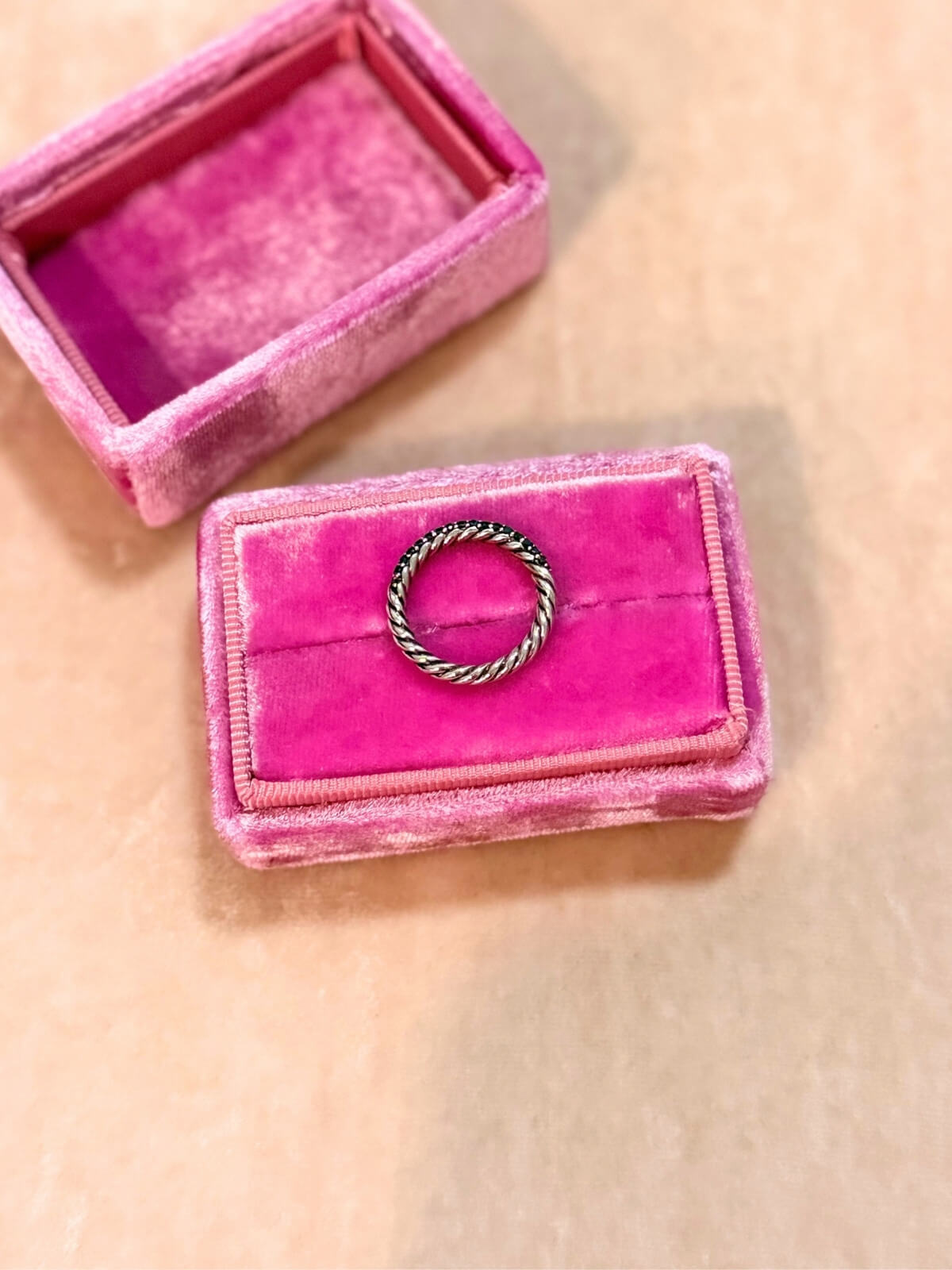 Louise Row featuring David Yurman Petite Pave black diamond ring on pink fixture