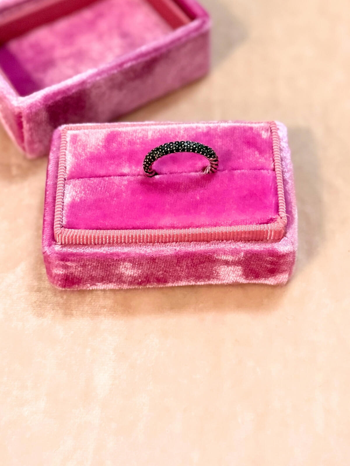 Louise Row featuring David Yurman Petite Pave black diamond ring on pink fixture