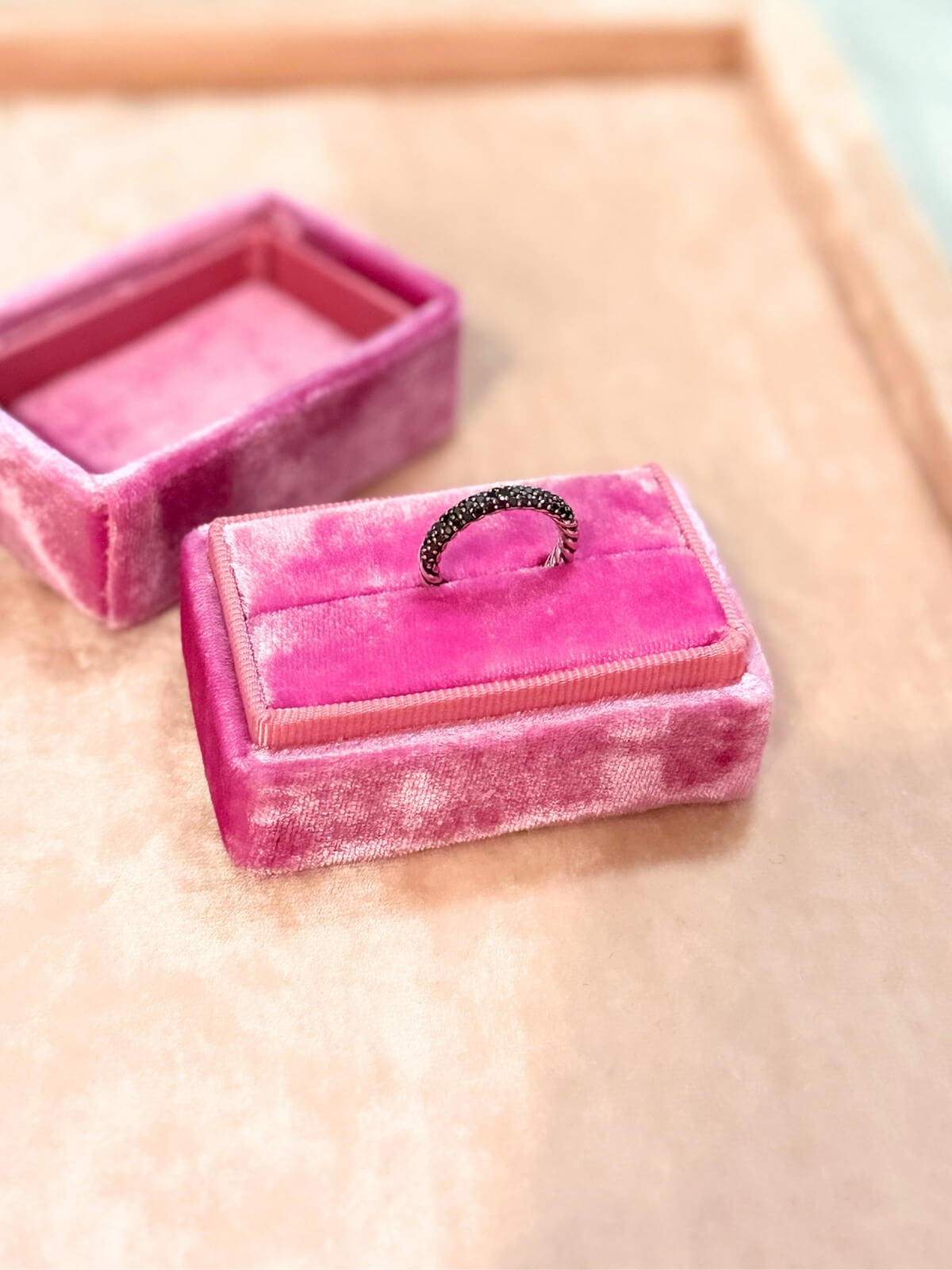 Louise Row featuring David Yurman Petite Pave black diamond ring on pink fixture