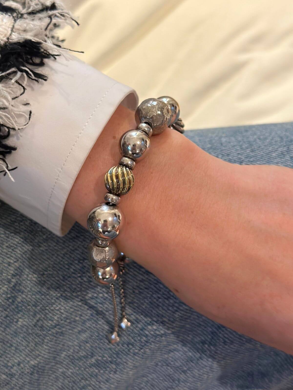 David Yurman silver bead bracelet on model.