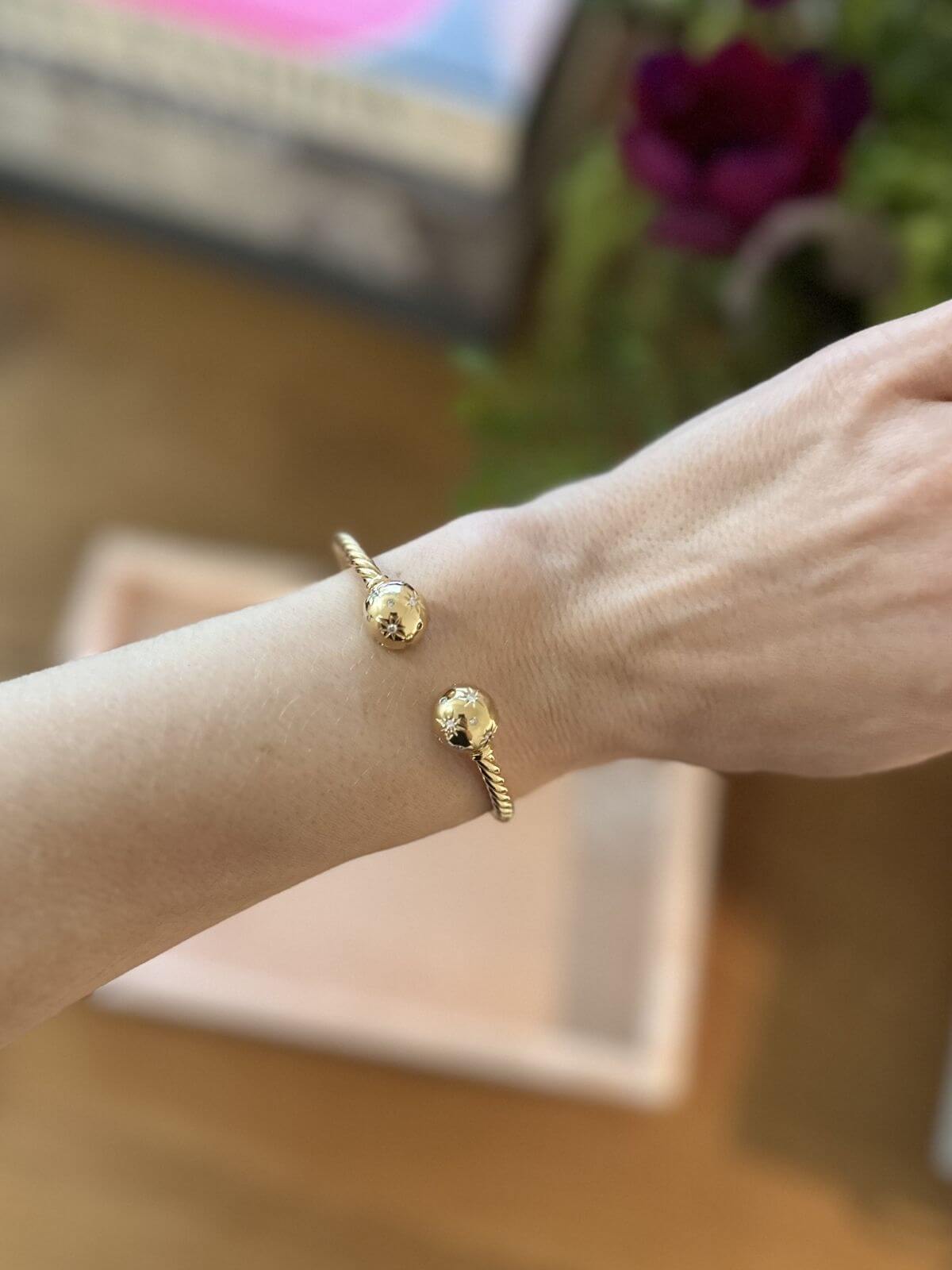 Gold David Yurman Solari bracelet on arm