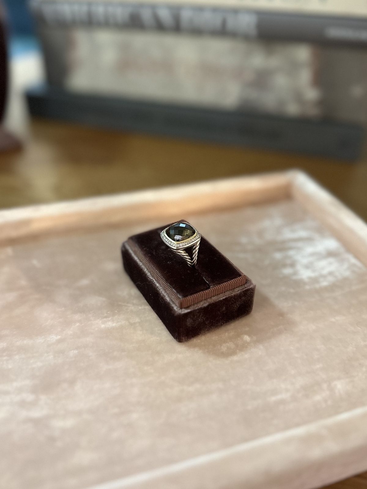 David yurman Albion ring in brown box on pink fixture side