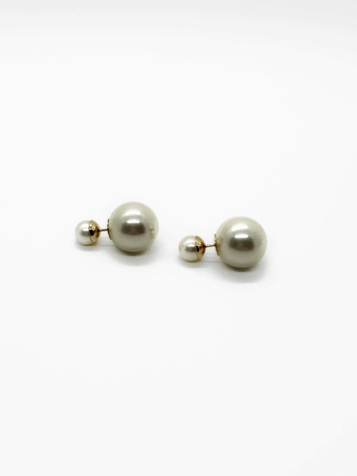 Pair of pearl earrings on a white background