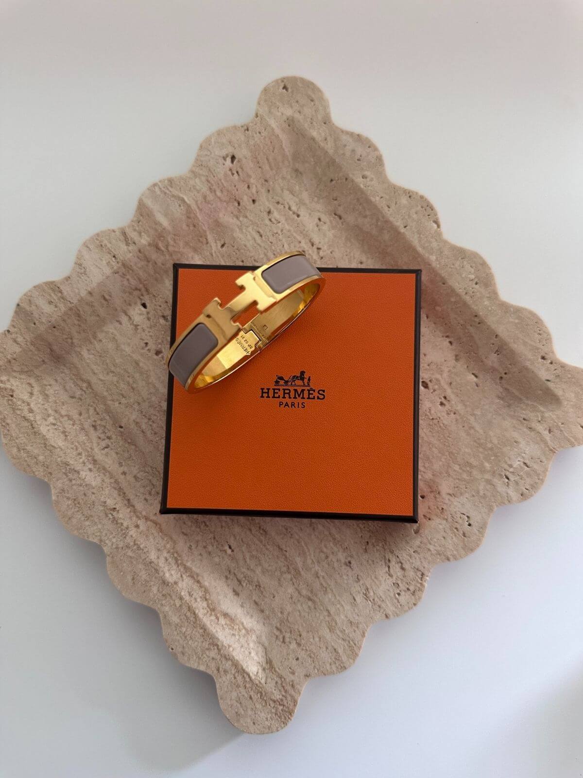 Hermes Clic H Bracelet with box on marble tray