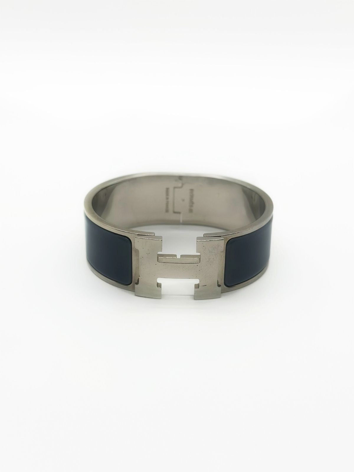 Hermes H bracelet with grey enamel on white background