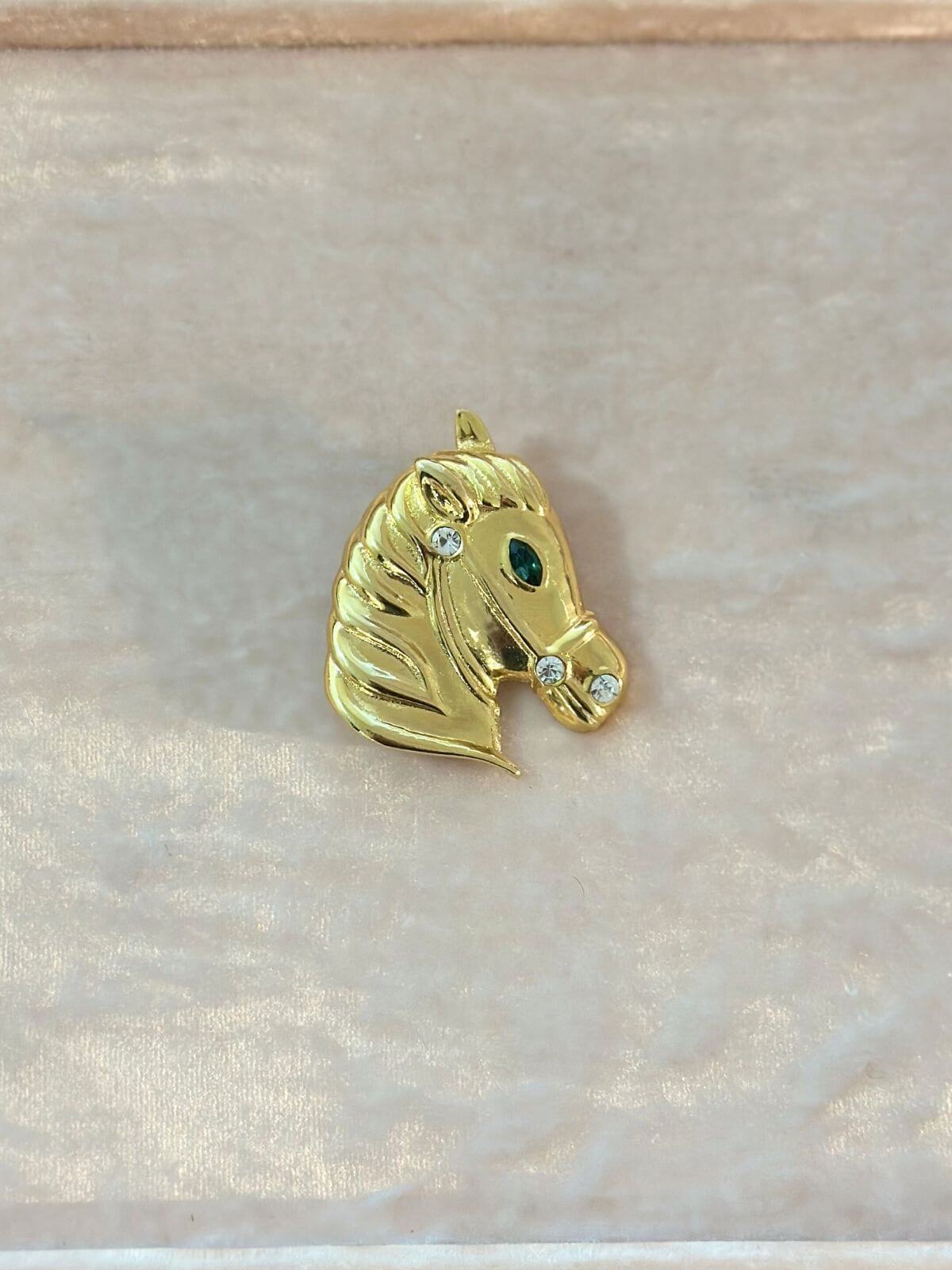 Louise Row Studio Vintage gold Horse Brooch on white cardigan on pink display tray