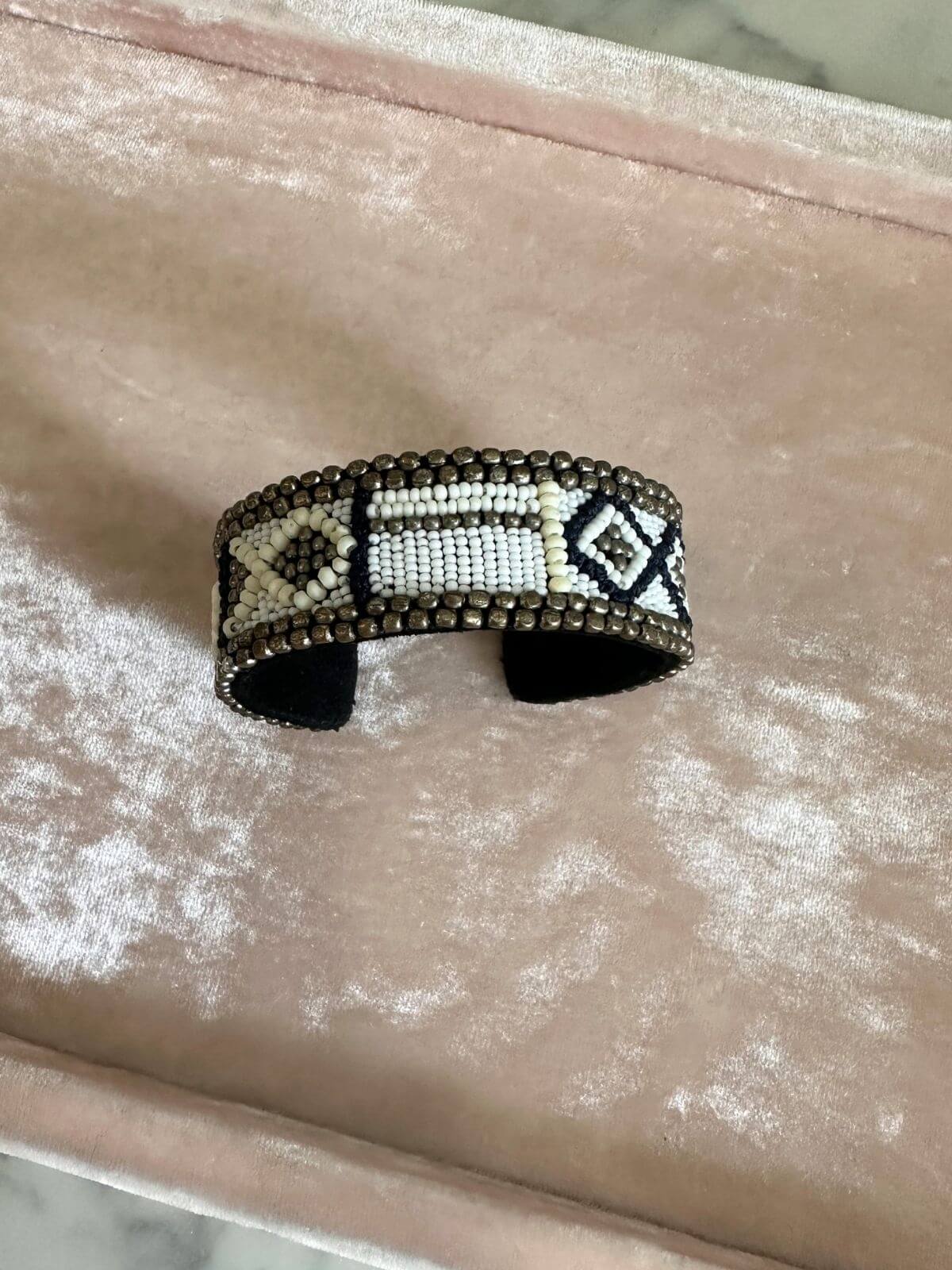 Louise Row Studio featuring Isabel Marant beaded cuff on pink tray