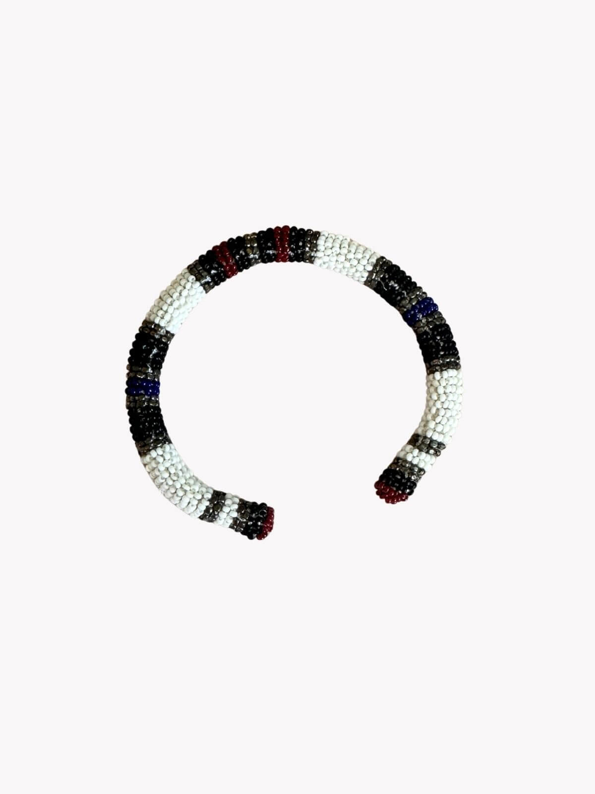 Louise Row Studio featuring Isabel Marant beaded cuff on white background.