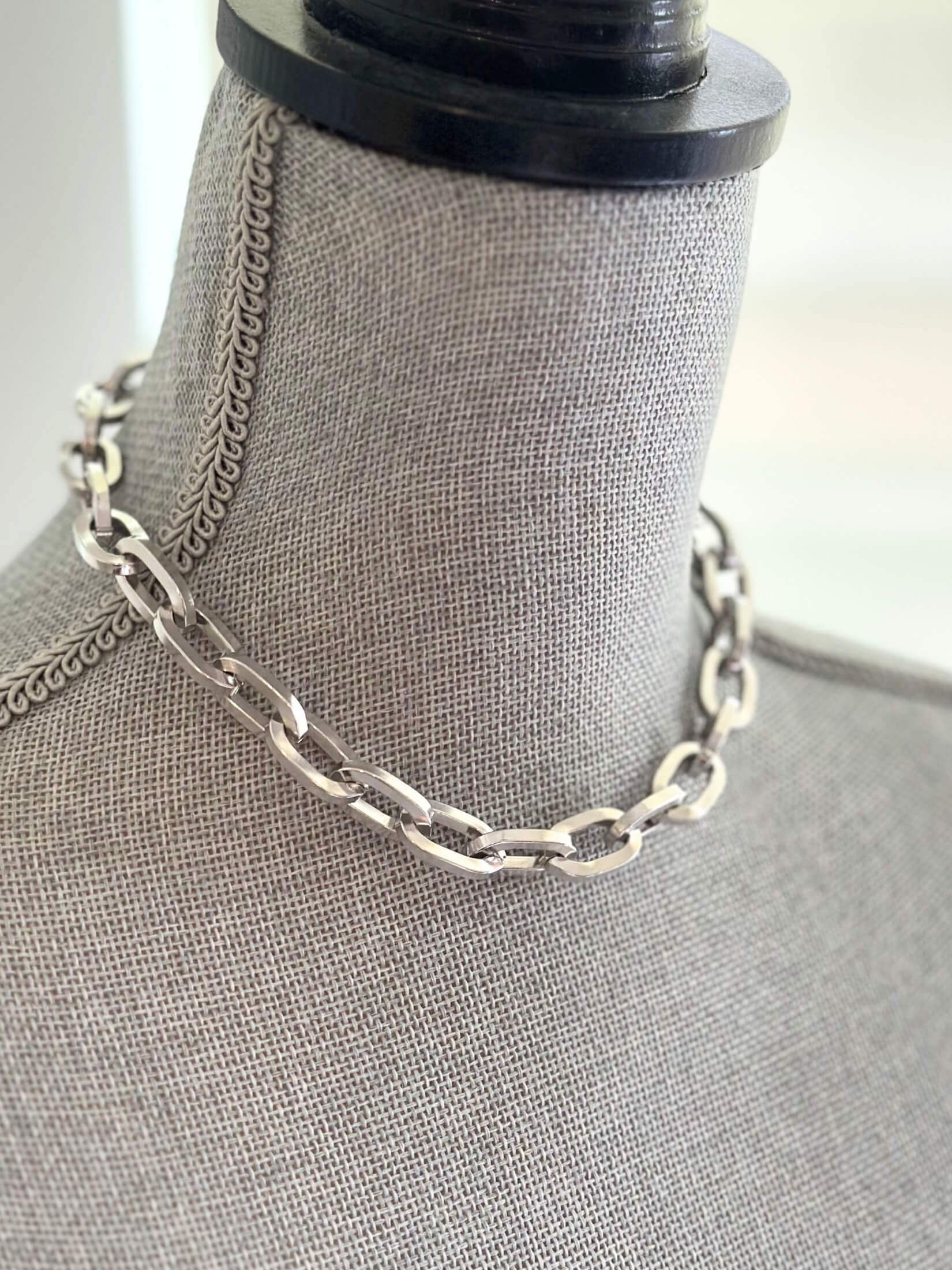 Louise Row featuring Jennifer Fisher silver large link chain necklace on grey mannequin