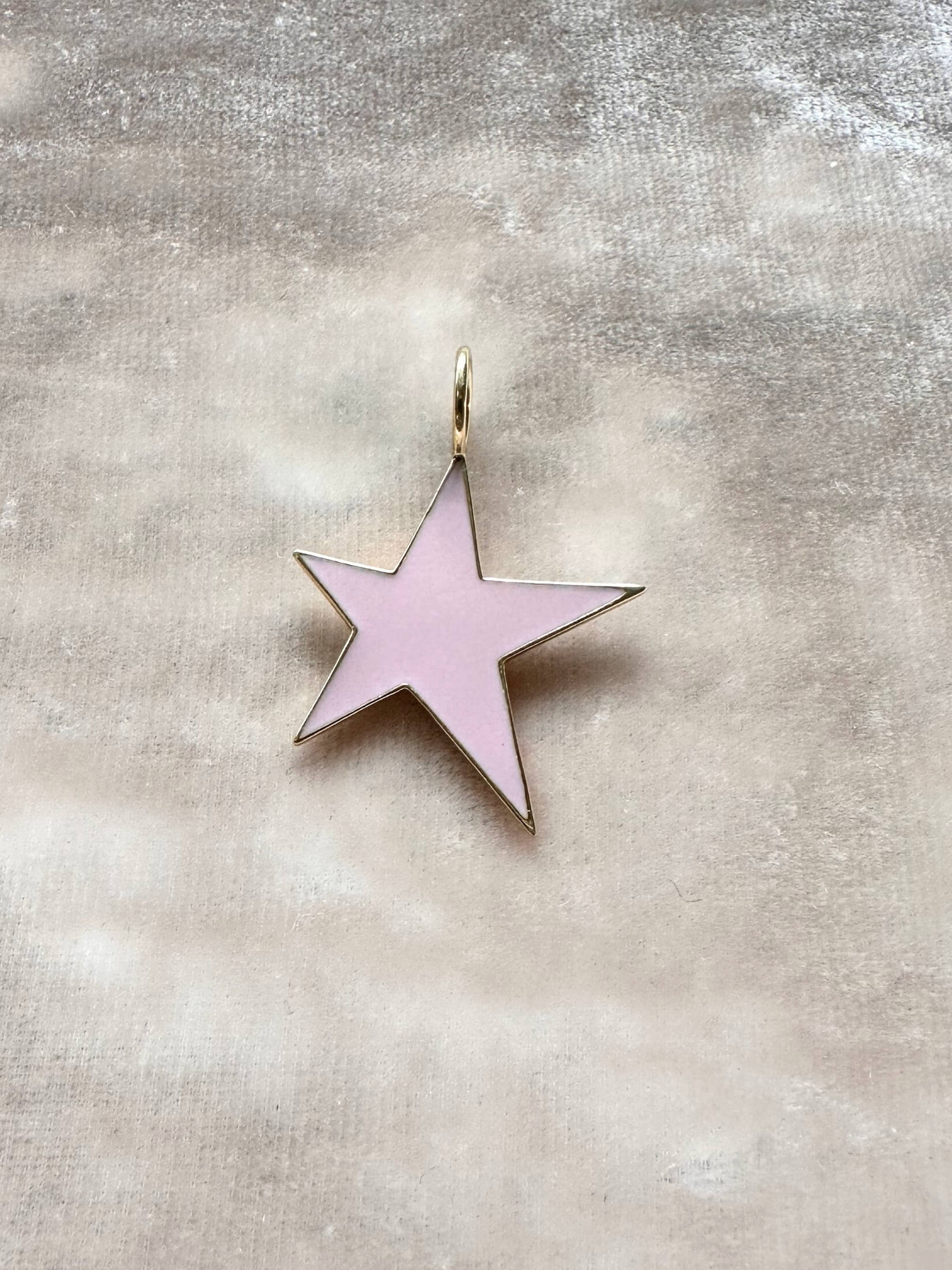 Louise Row featuring Jennifer Fisher Star charm on pink background