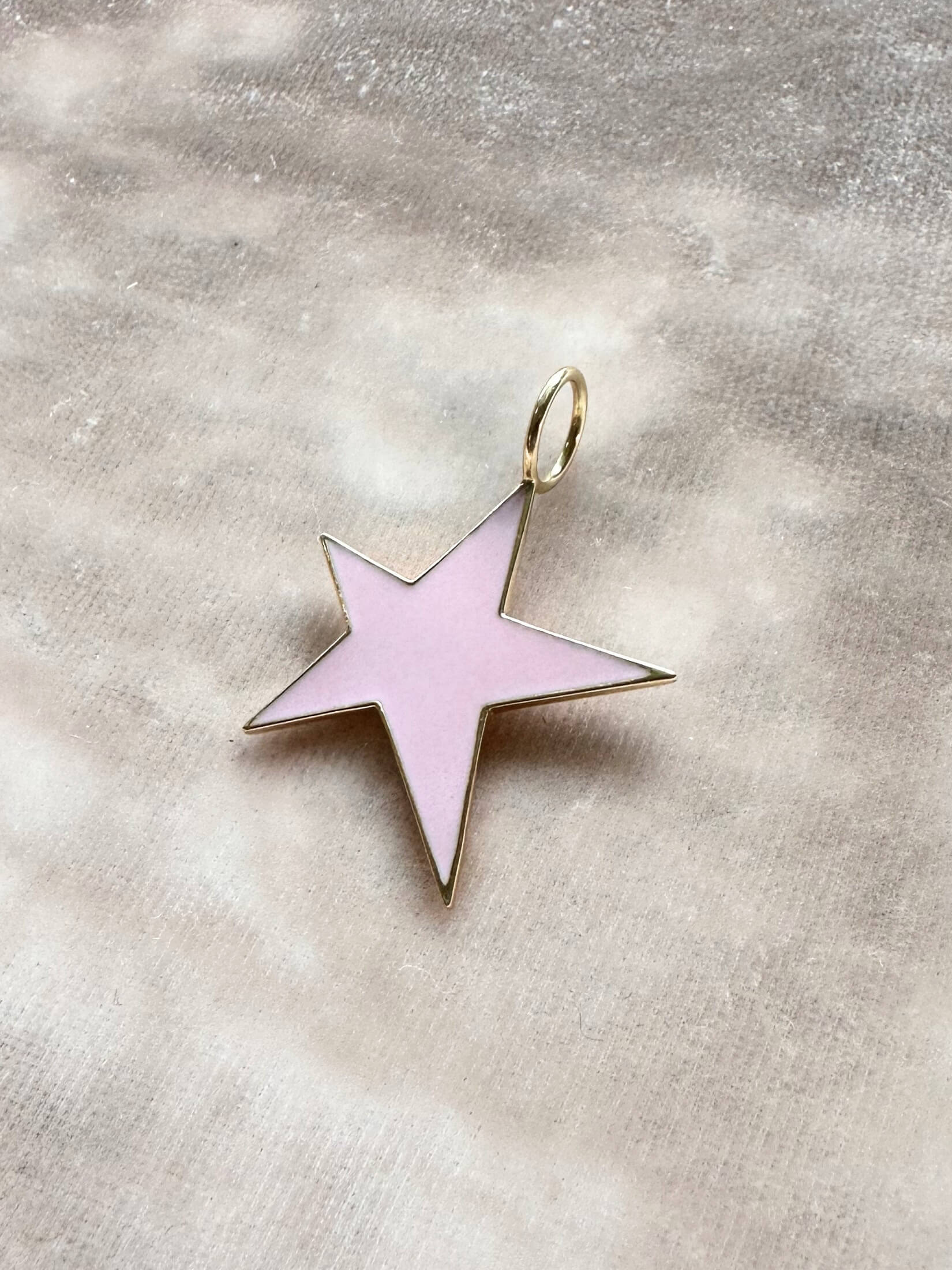 Louise Row featuring Jennifer Fisher Star charm on pink background