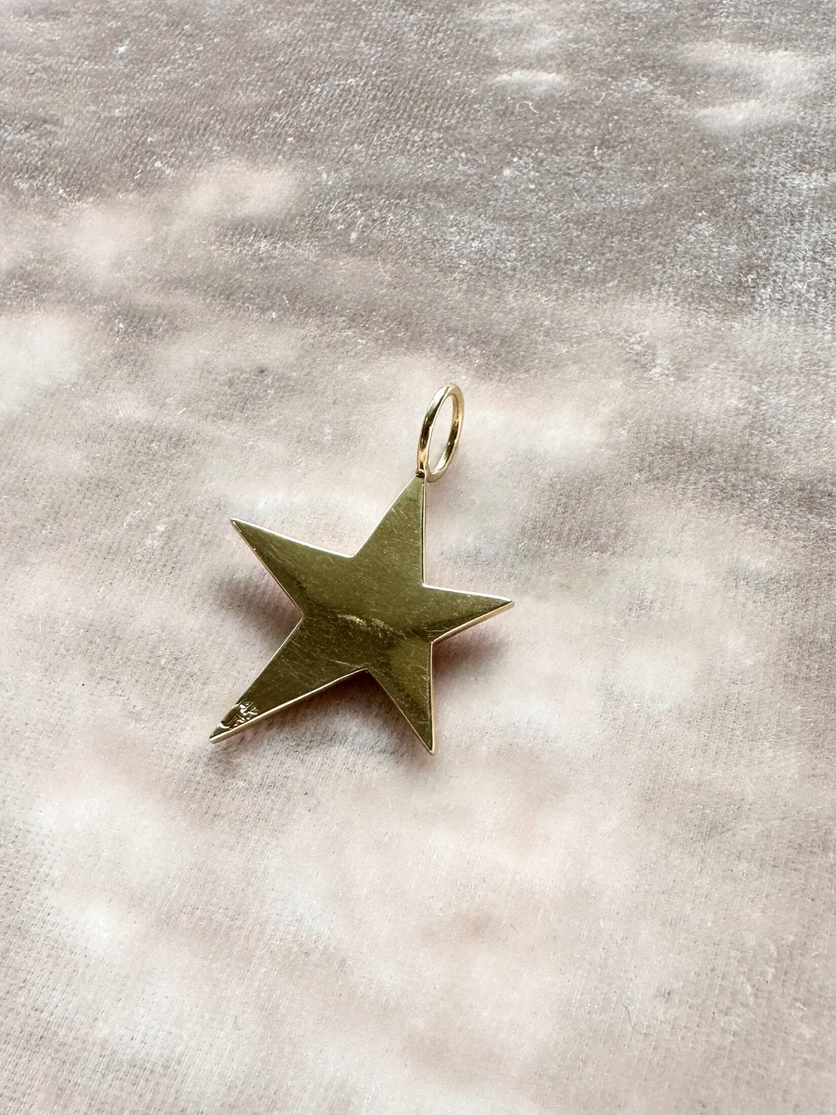Louise Row featuring Jennifer Fisher Star charm on pink background back side