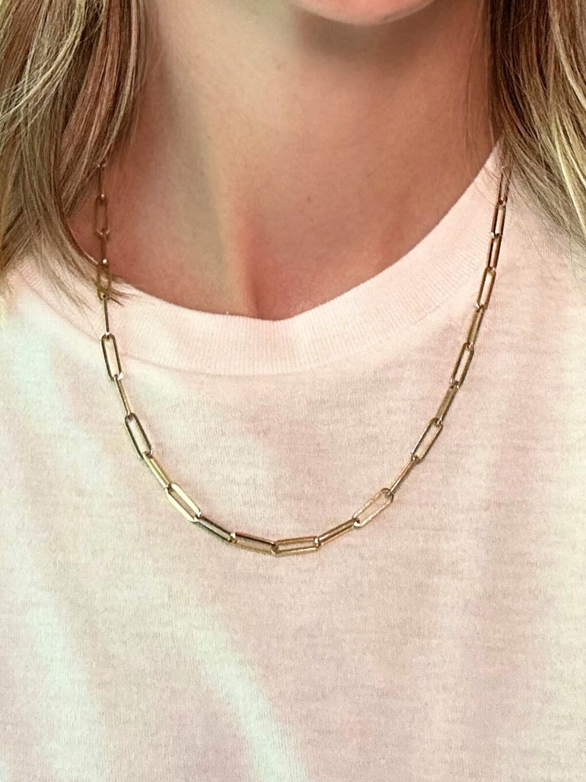 Louise Row featuring Jennifer Fisher paperclip necklace on model in white tee