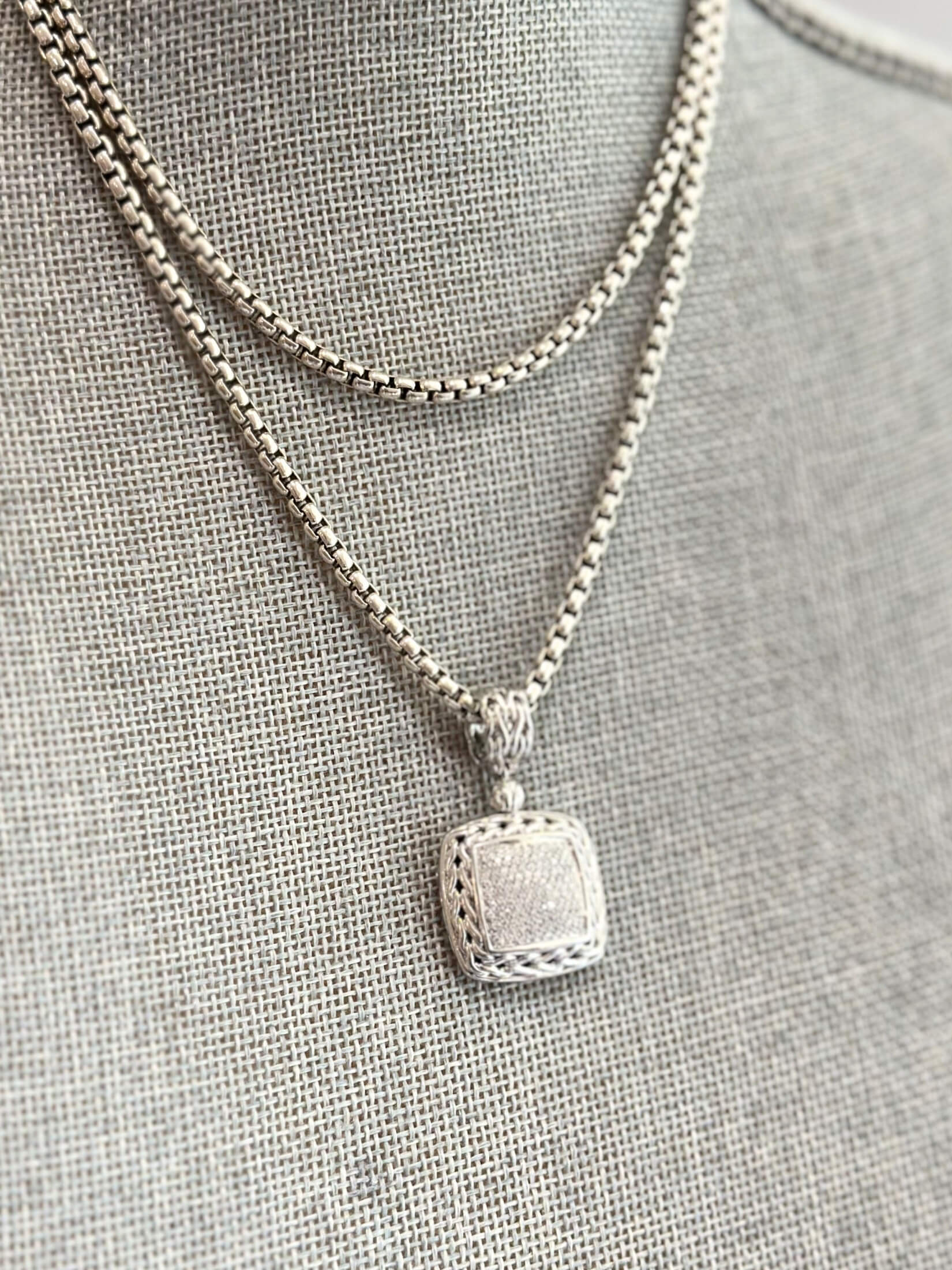 Louise Row featuring John Hardy Diamond Pendant in silver on grey mannequin