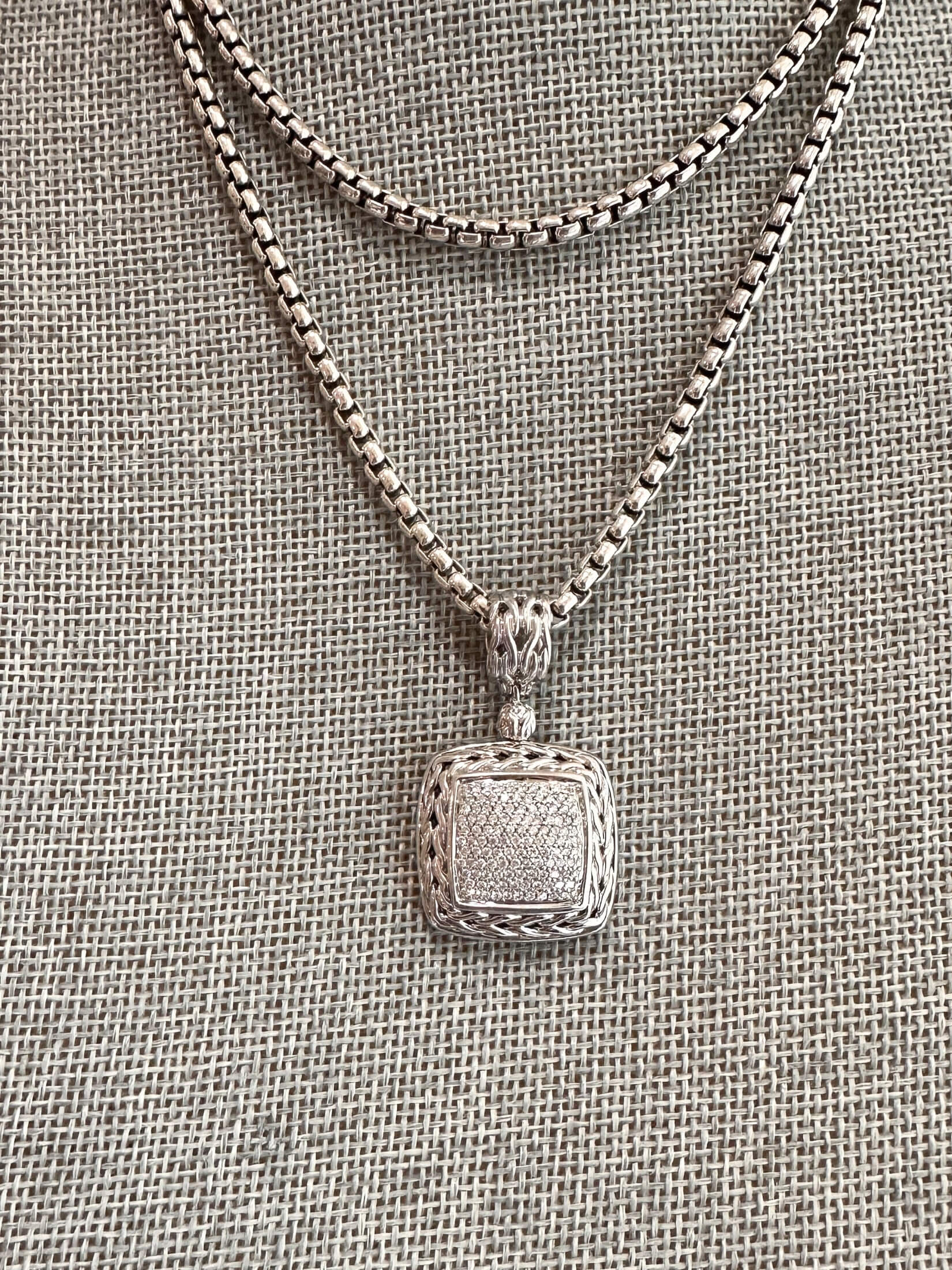 Louise Row featuring John Hardy Diamond Pendant in silver on grey mannequin