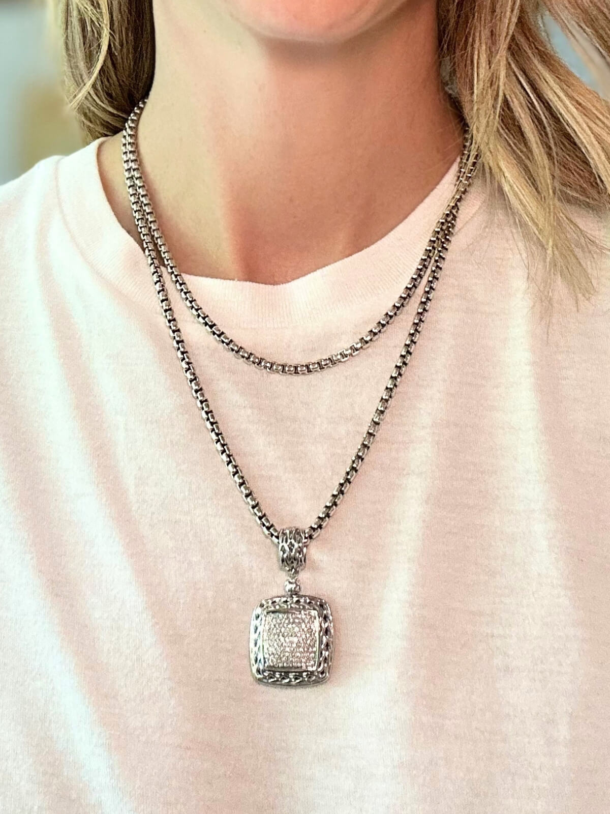 Louise Row featuring John Hardy diamond pendant on model in white tee