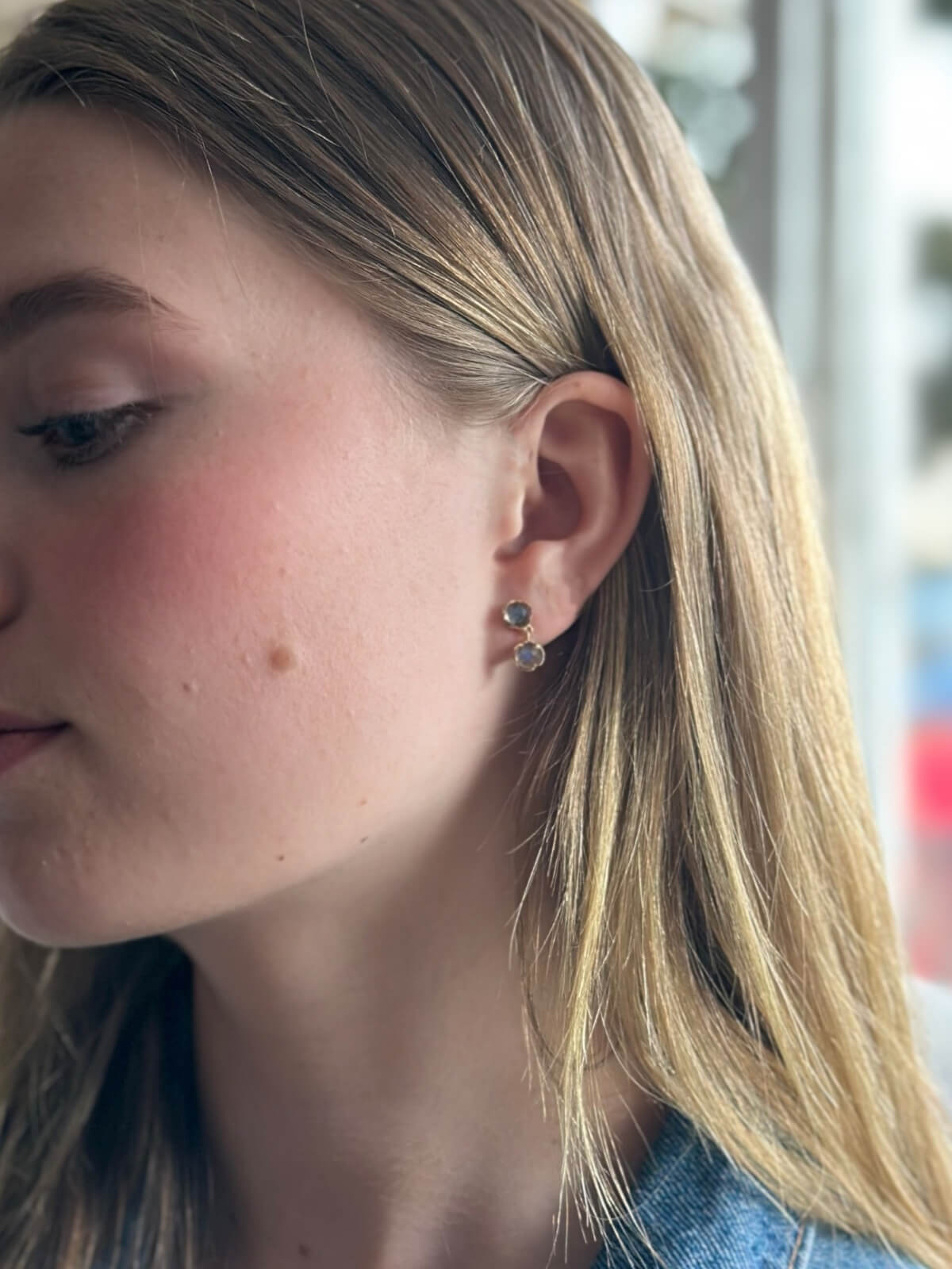 Louise Row Studio featuring model in labradorite 2 drop earrings with jean jacket