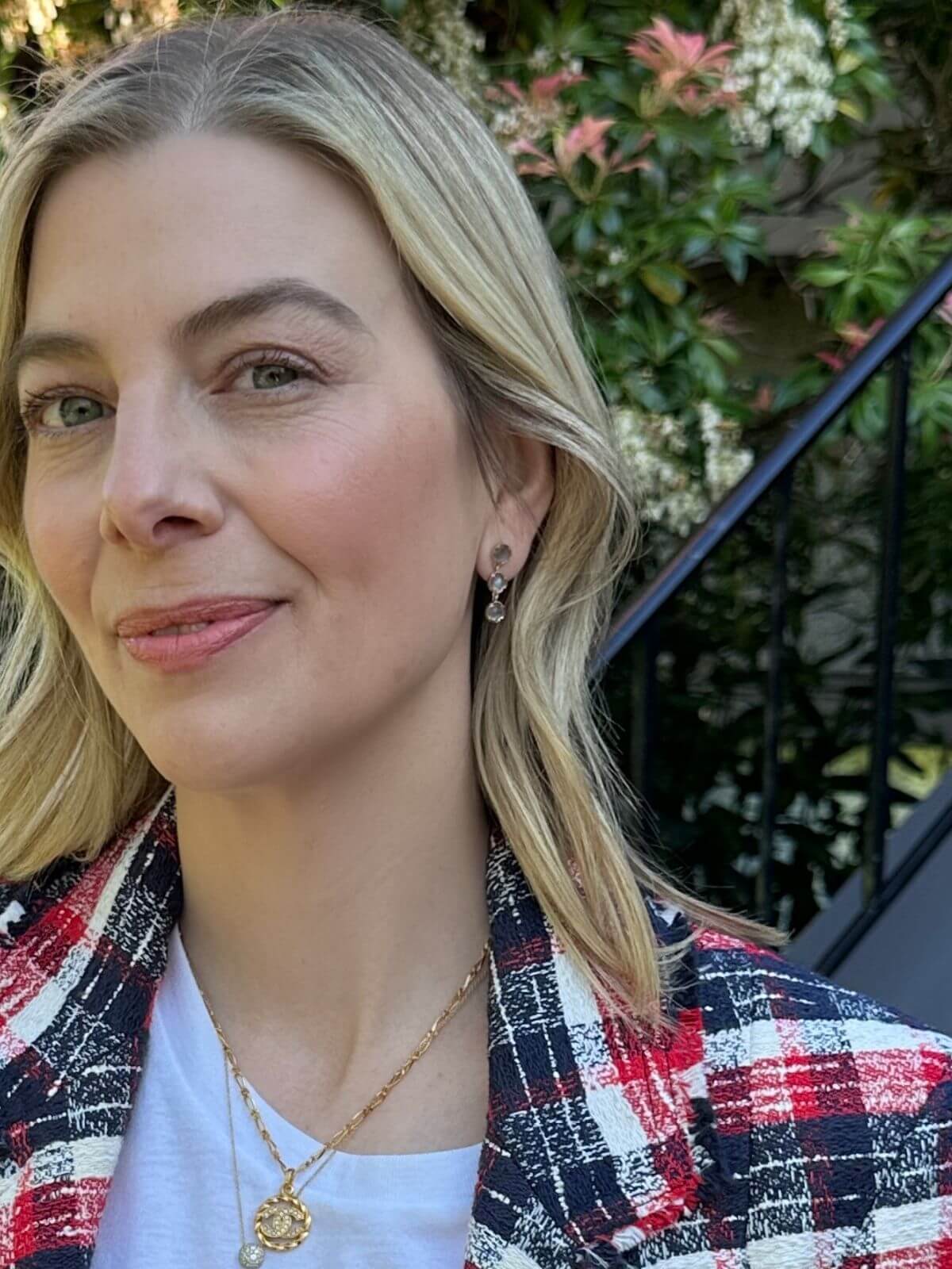 Louise Row Studio earrings, model wearing 3 drop 18K labradorite stone drop earrings with blonde hair wearing a plaid jacket outdoors