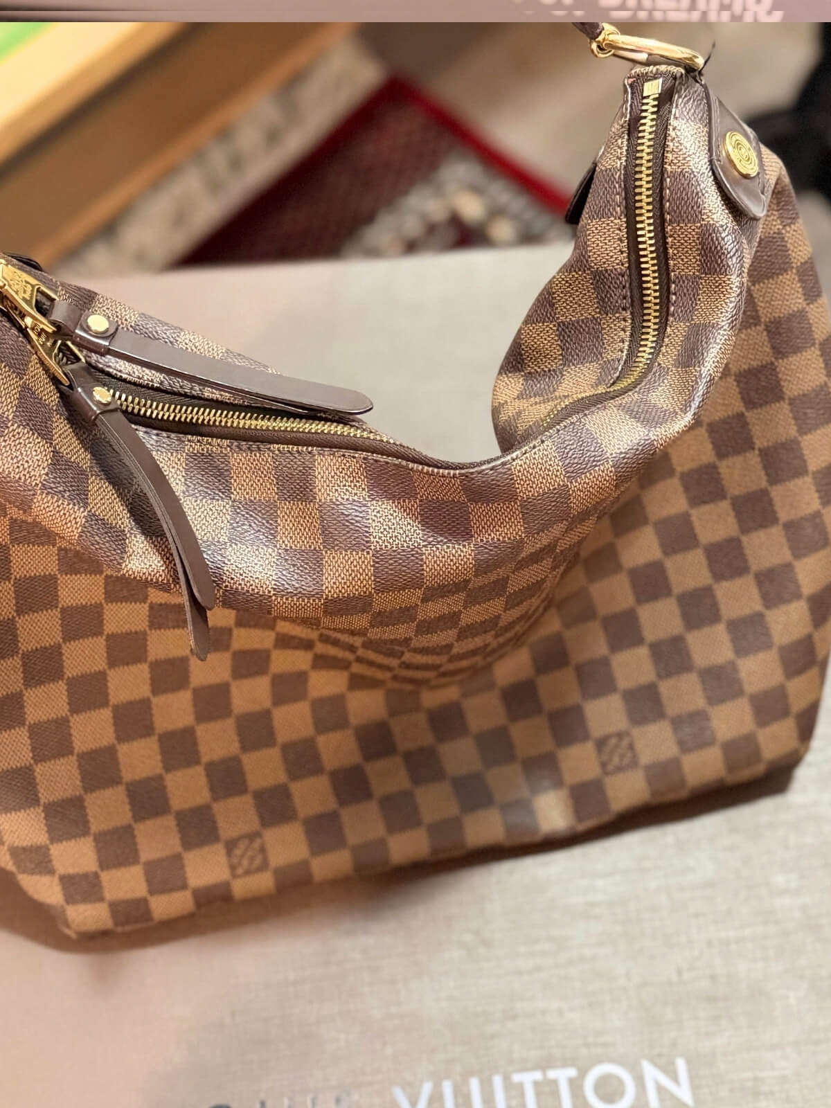 Louise Row featuring Louise Vuitton Damier Ebene bag in box or on mannequin