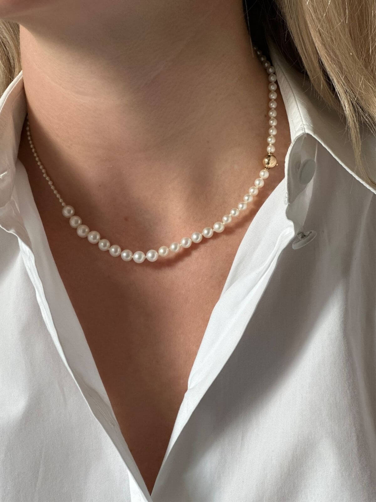 Sophie Bille Brahe freshwater pearl necklace on model in white shirt
