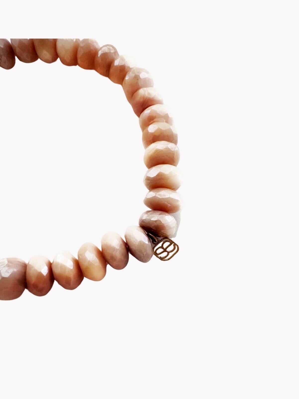 Louise Row Studio featuring Carolina Bucci pink bead bracelet on white background , detail.