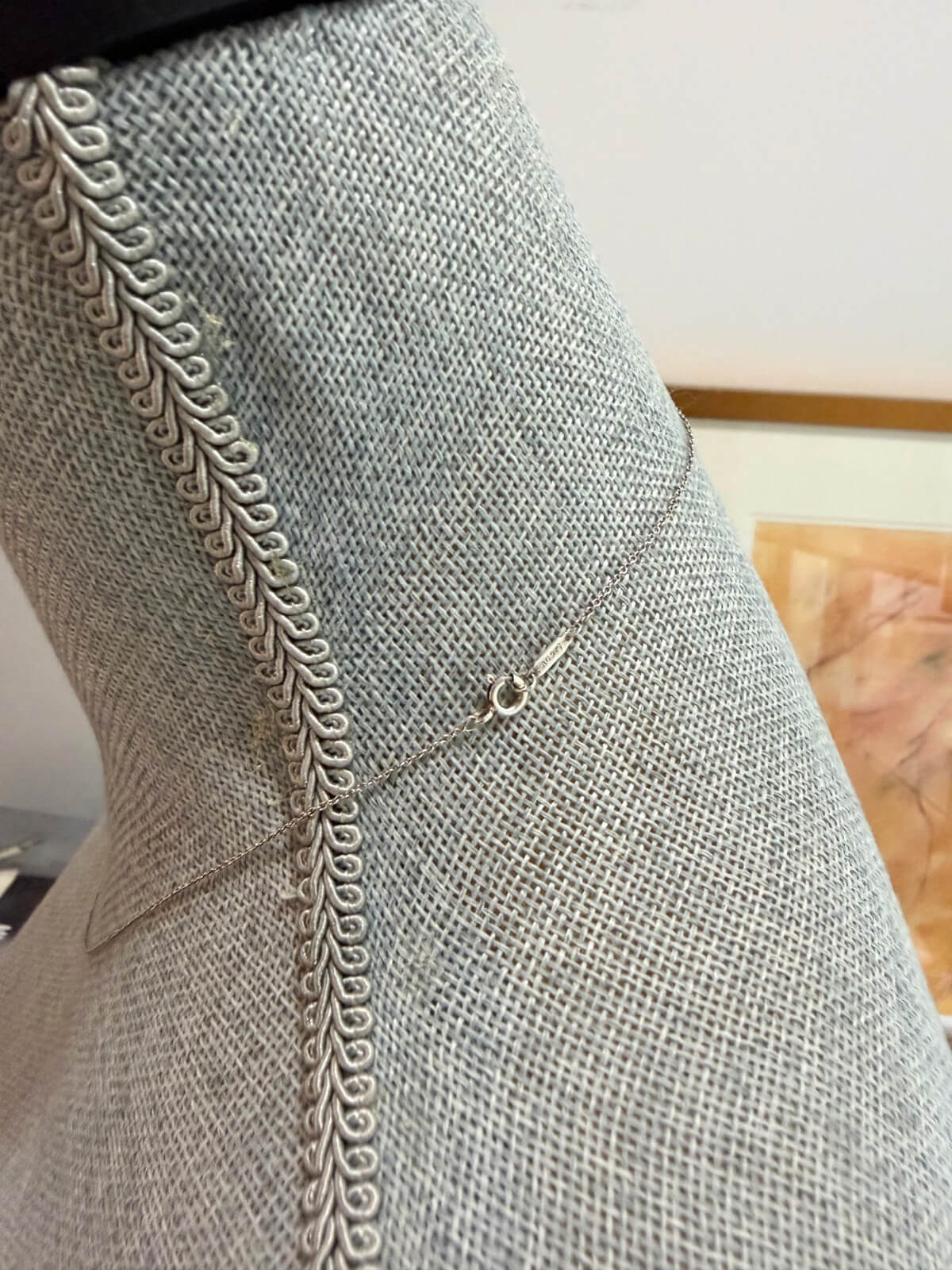 Louise Row featuring Tiffany & Co Circles Necklace on grey Mannequin