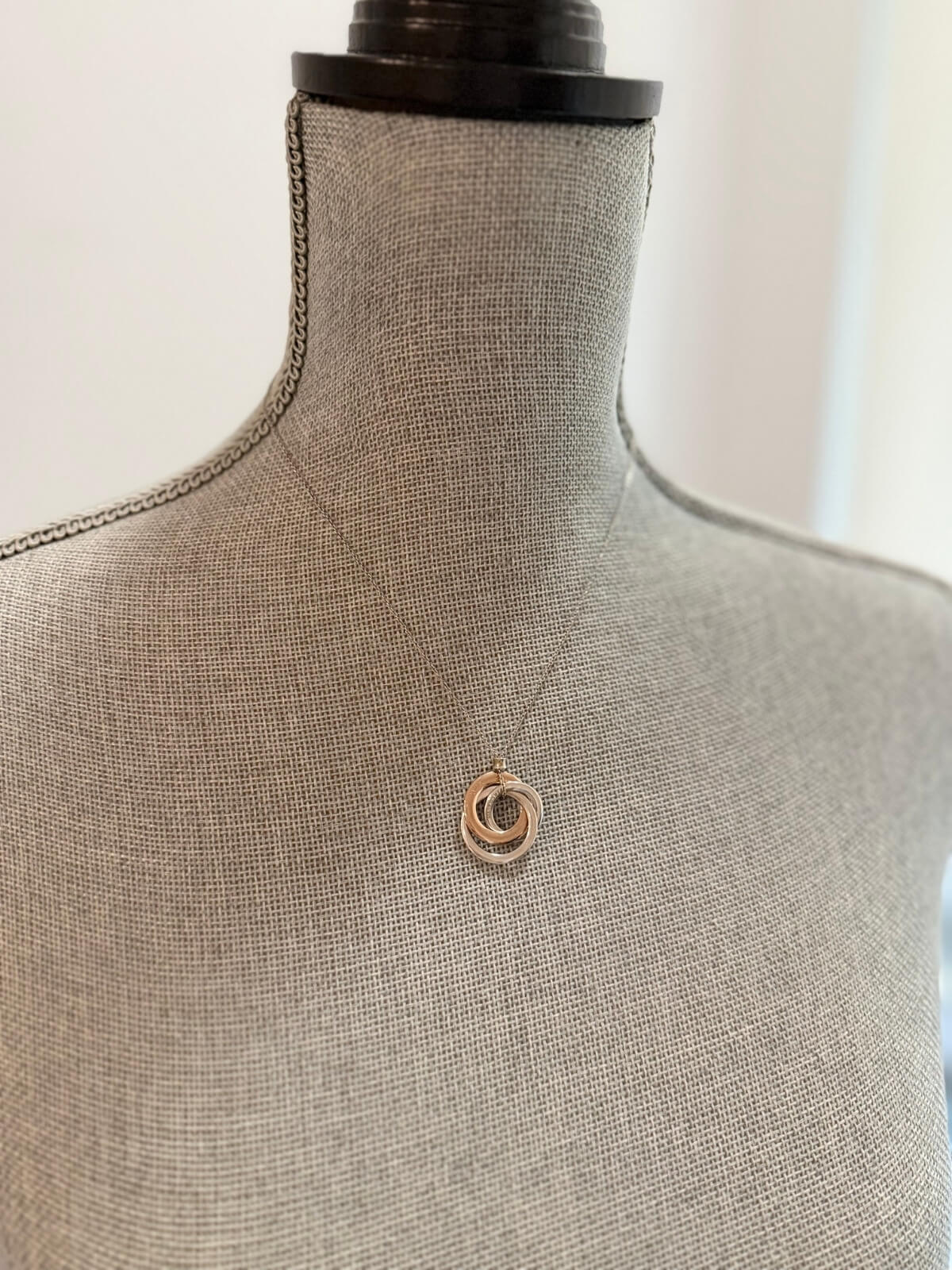 Louise Row featuring Tiffany & Co Circles Necklace on grey Mannequin