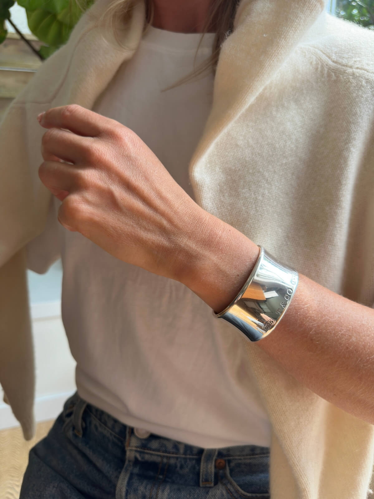 Louise Row Studio featuring Tiffany & Co Silver cuff on model with sweater