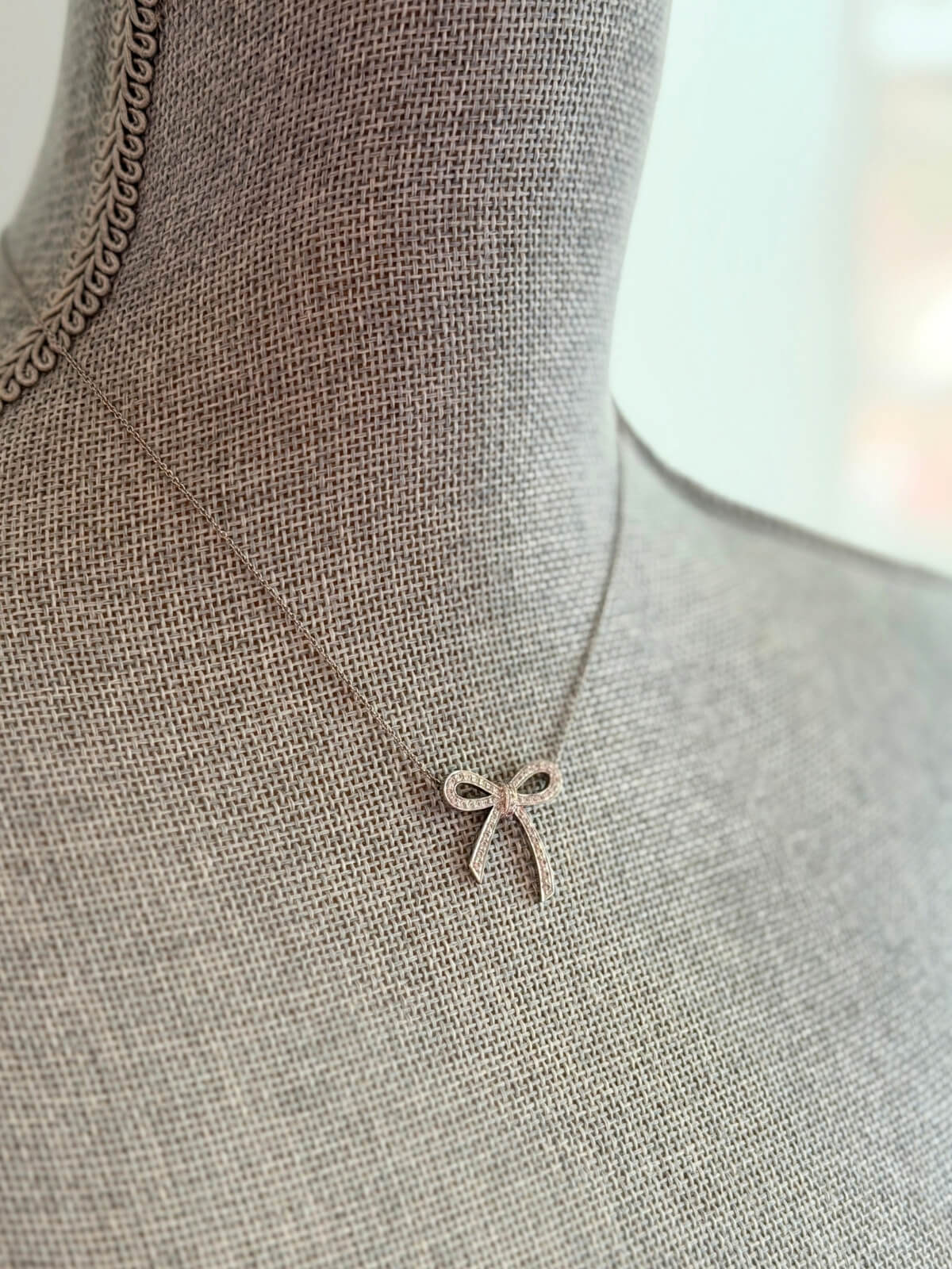 Louise Row featuring Tiffany platinum and diamond bow necklace