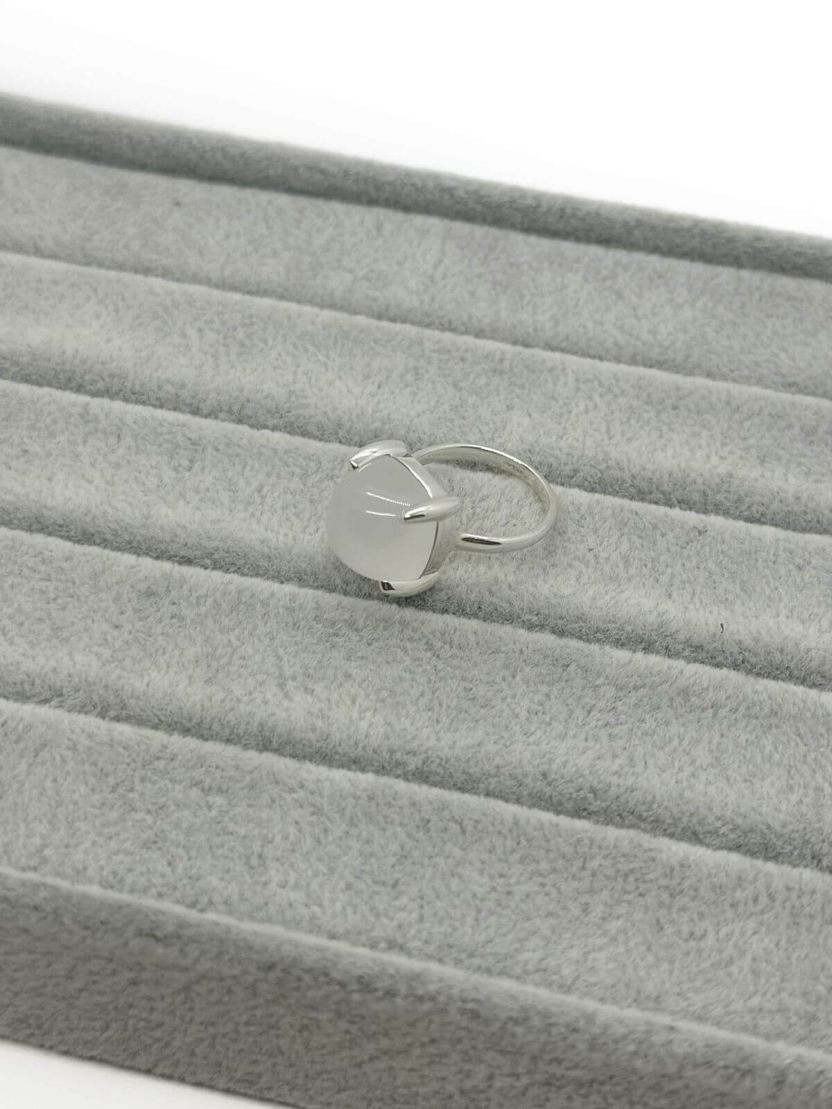 Tiffany silver and quartz ring on grey background