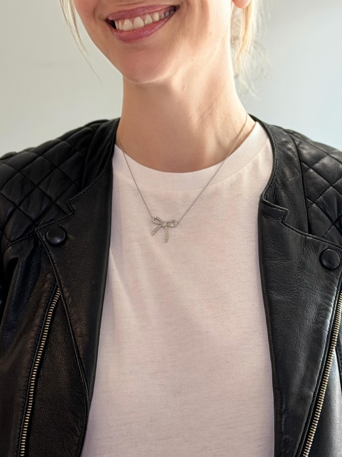 Louise Row featuring Tiffany platinum and diamond bow necklace on model