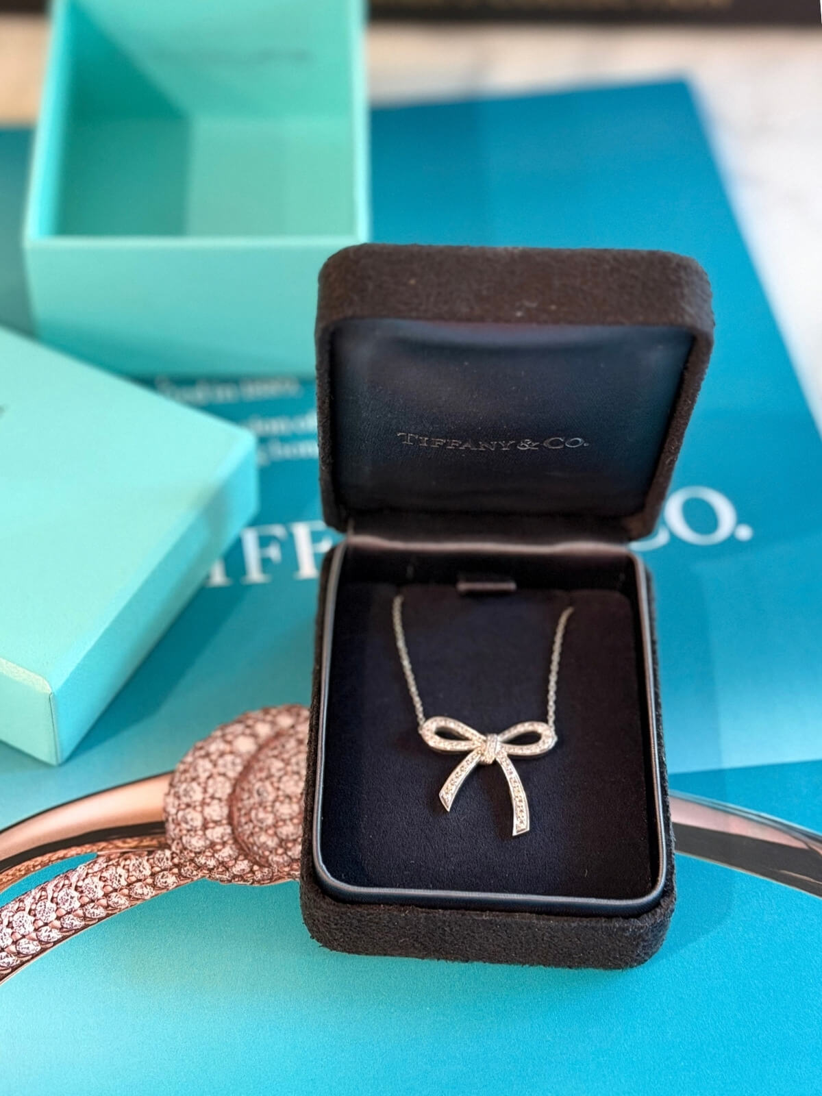 Louise Row featuring Tiffany platinum and diamond bow necklace in box