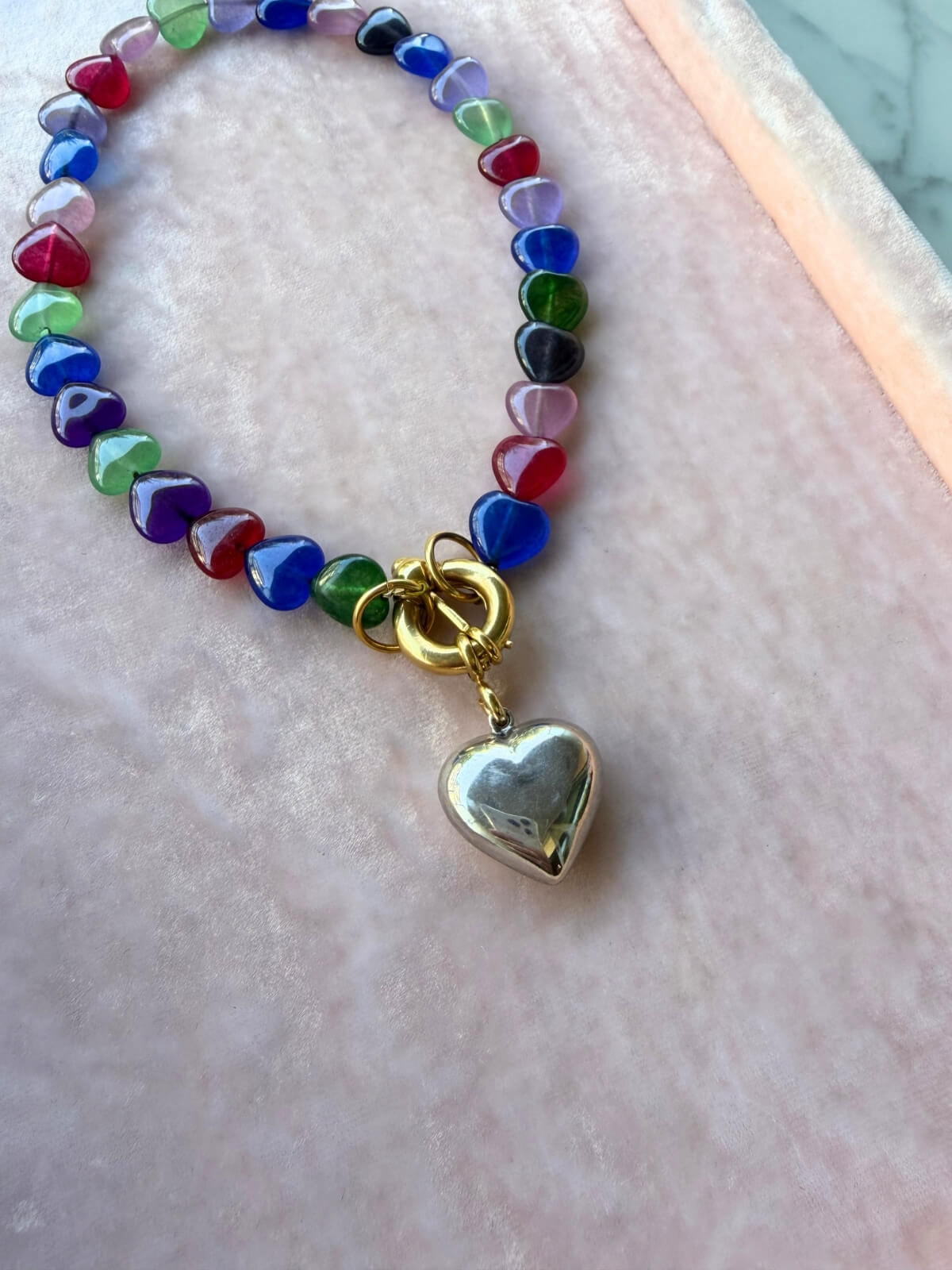 Louise Row featuring Timeless Pearly glass heart necklace on pink tray