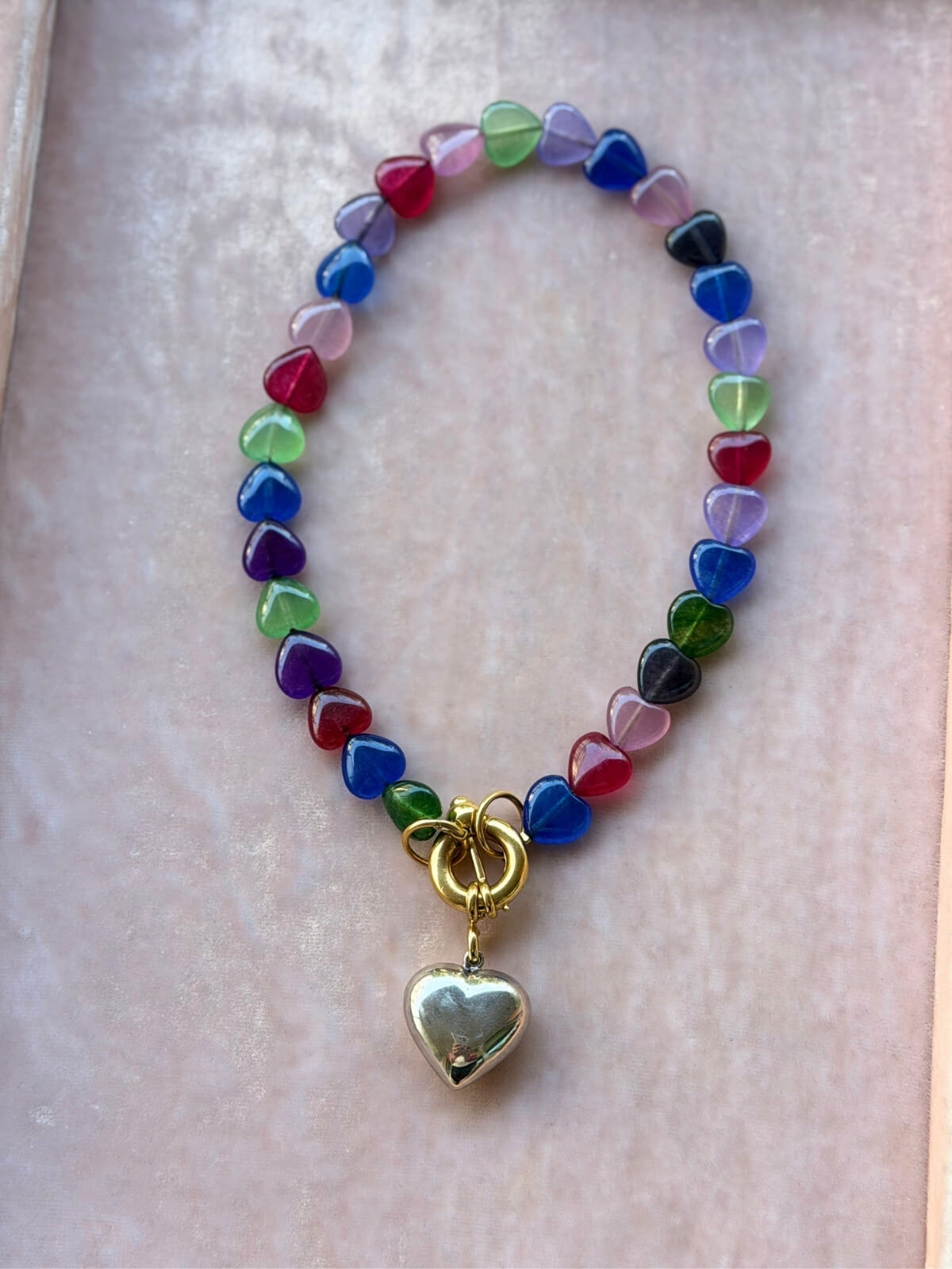 Louise Row featuring Timeless Pearly glass heart necklace on pink tray
