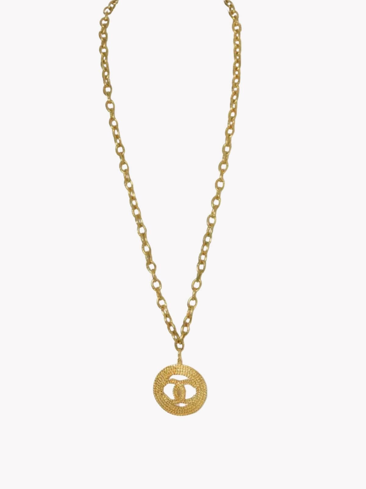 Louise Row Studio featuring Vintage Chanel medallion gold necklace on white background.