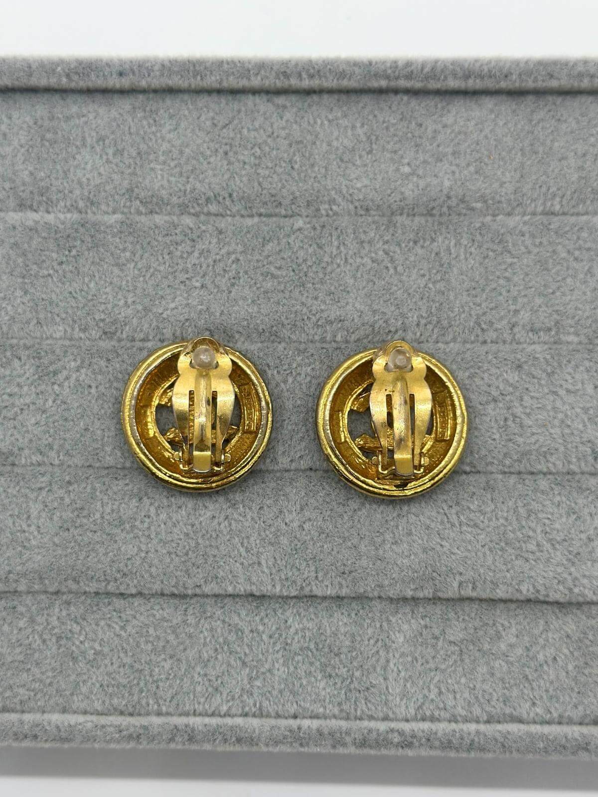 Vintage Gold CC Button earrings on grey background Back view