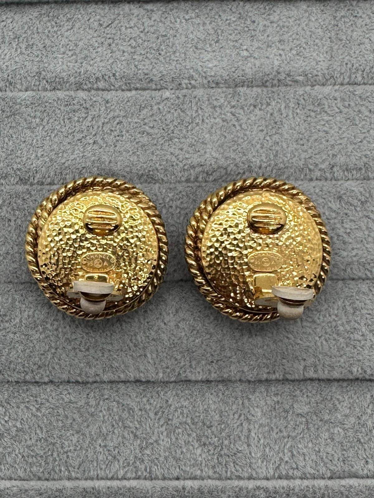 Vintage Changel Pearl and Gold Earring on grey background showing Signature