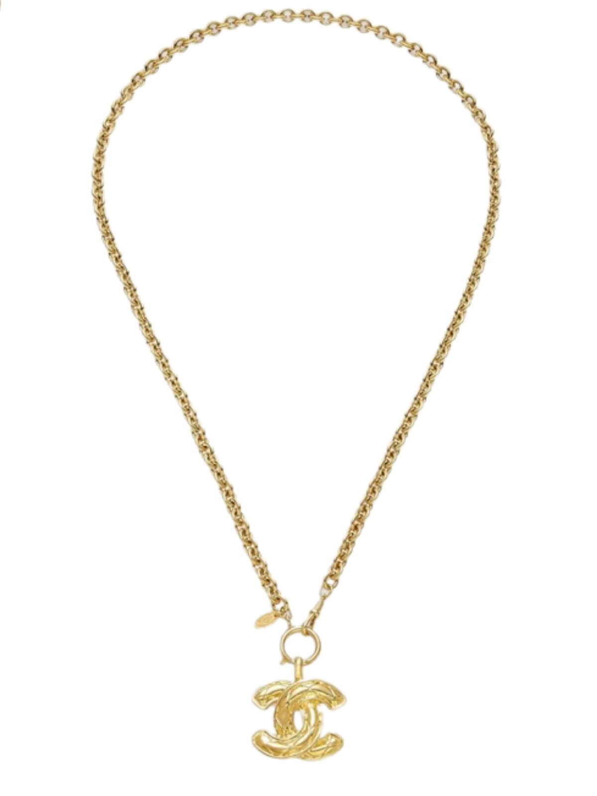 Gold necklace with a CC pendant on a white background